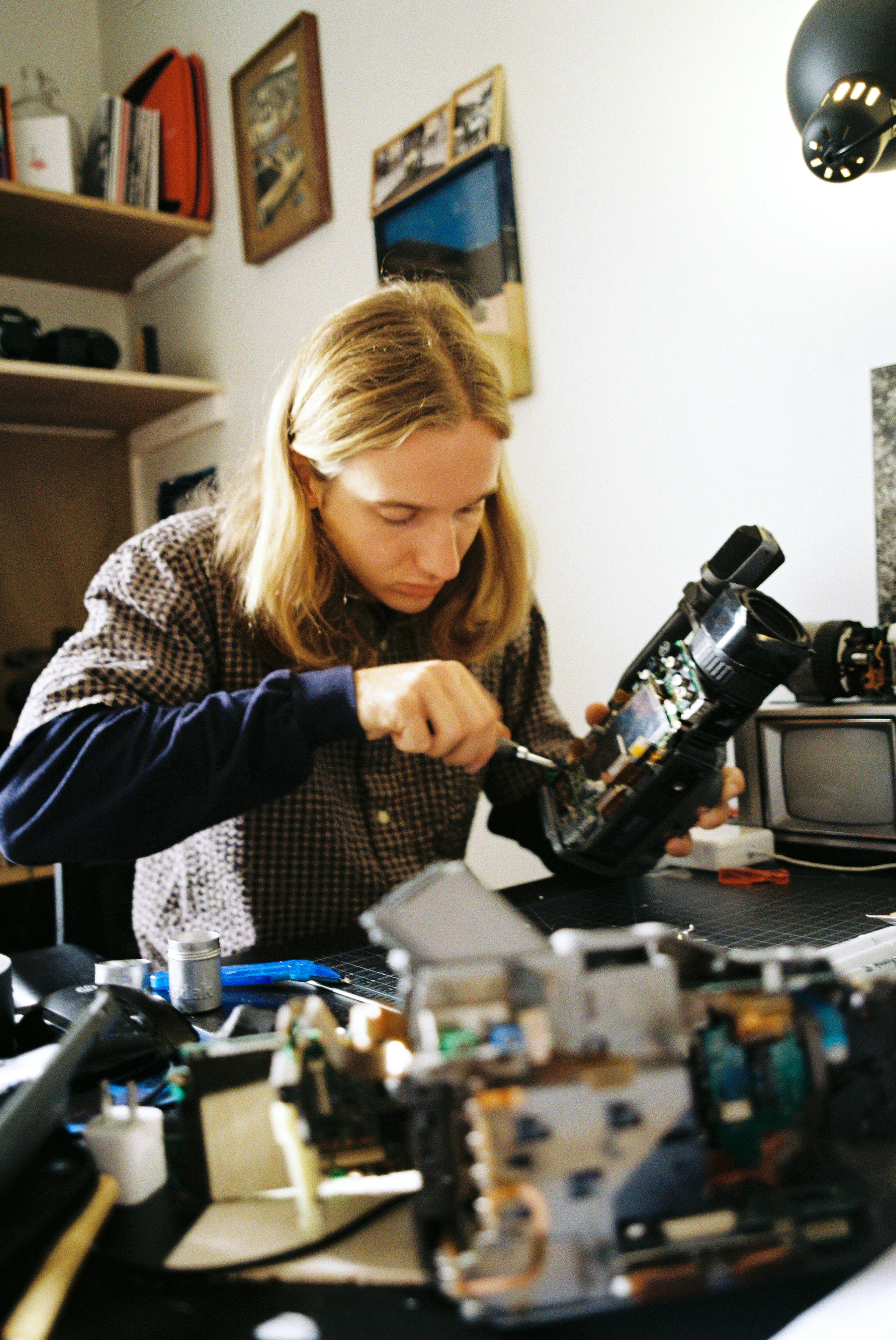 Zach Sayles repairing his VX. Photo: George Rose