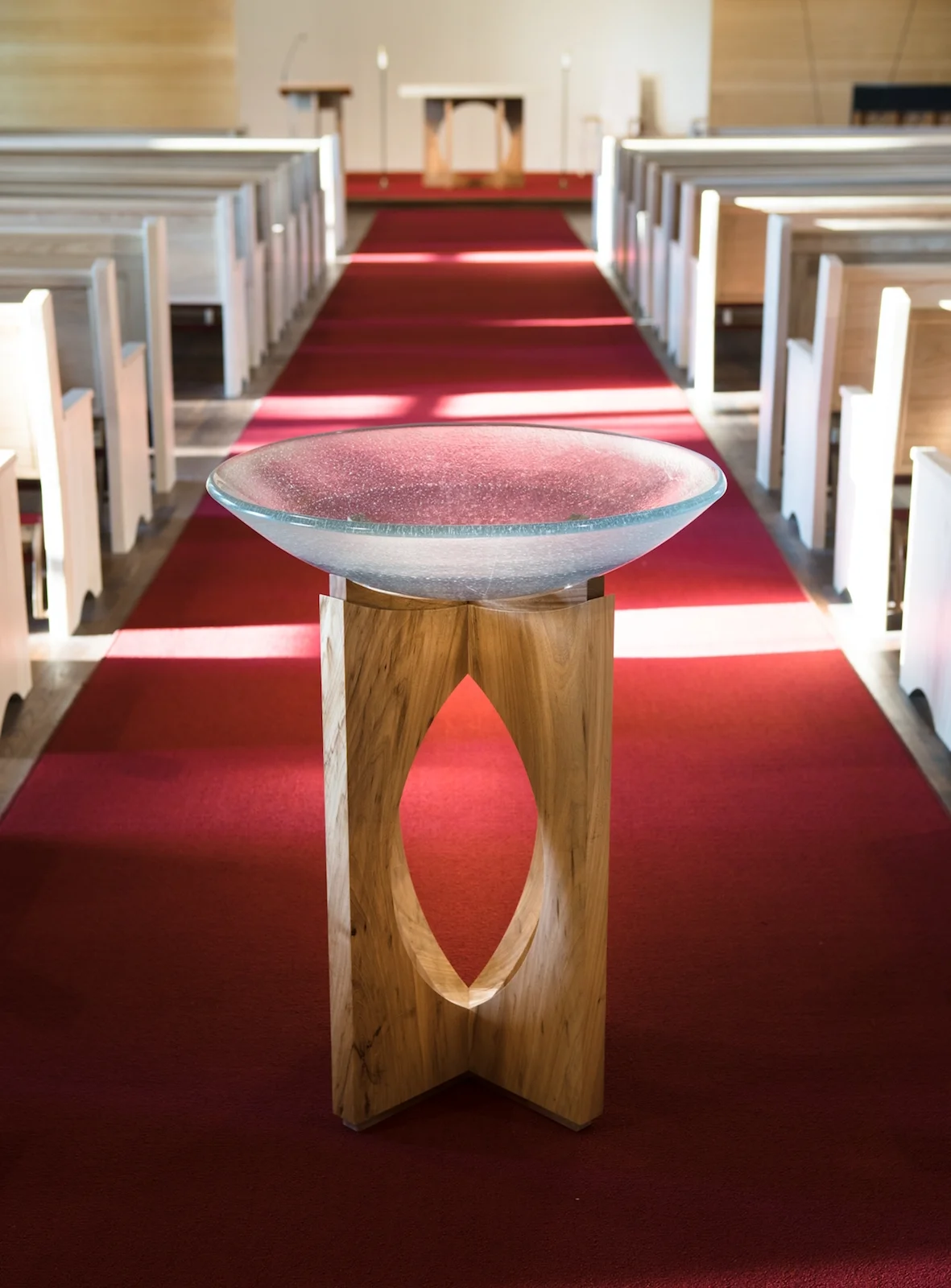 St. Edward's Chapel renovation by Pollen Architects, 2014 Baptism font 27" x 27" x 34" h Texas elm with glass vessel by Kathleen Ash at Studio K Macek Furniture's role was design and fabrication of liturgical furniture in coordination with the architects and the university.