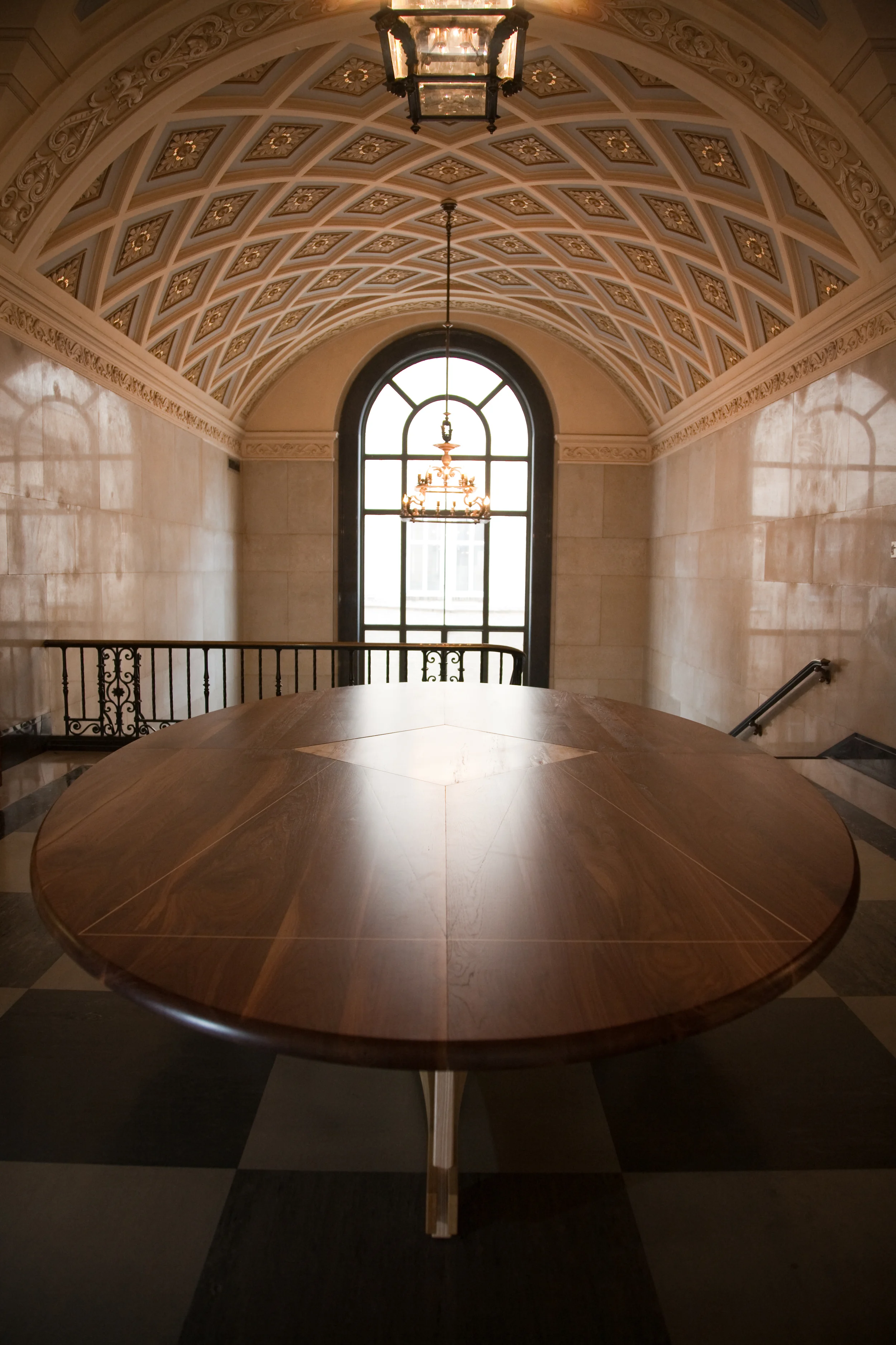 Seminar Tables for the School of Undergraduate Studies, Life Science Library, Main Building, the University of Texas at Austin. 2008 Each table has a diamond-shaped center panel as well as unique diagonal inlays which annotate the geometric properties of ellipses. This table inlay is two triangles which begin and end at the two foci of the 14' ellipse. The photographs were taken in the lobby of the library, rather than the classrooms where the tables reside. The walnut table top will slowly turn more amber to match the library's other furniture.