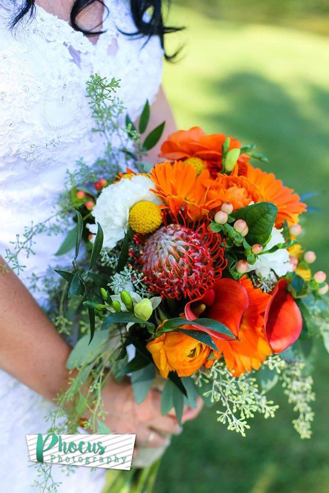 Shades of orange for this beautiful bride! (photo credit Phocus Photography)