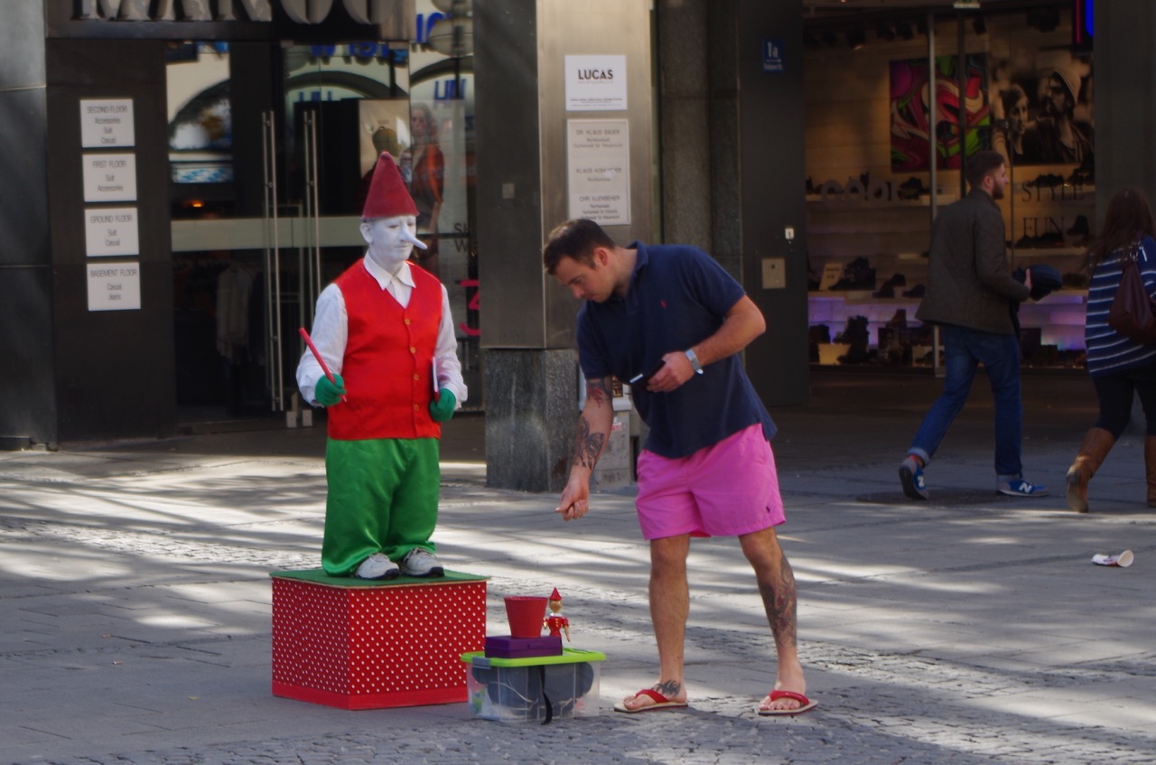 Definitely not the violinist, but another fine specimen of Munich Street Performer I will refer to as the Munich Munchkin.