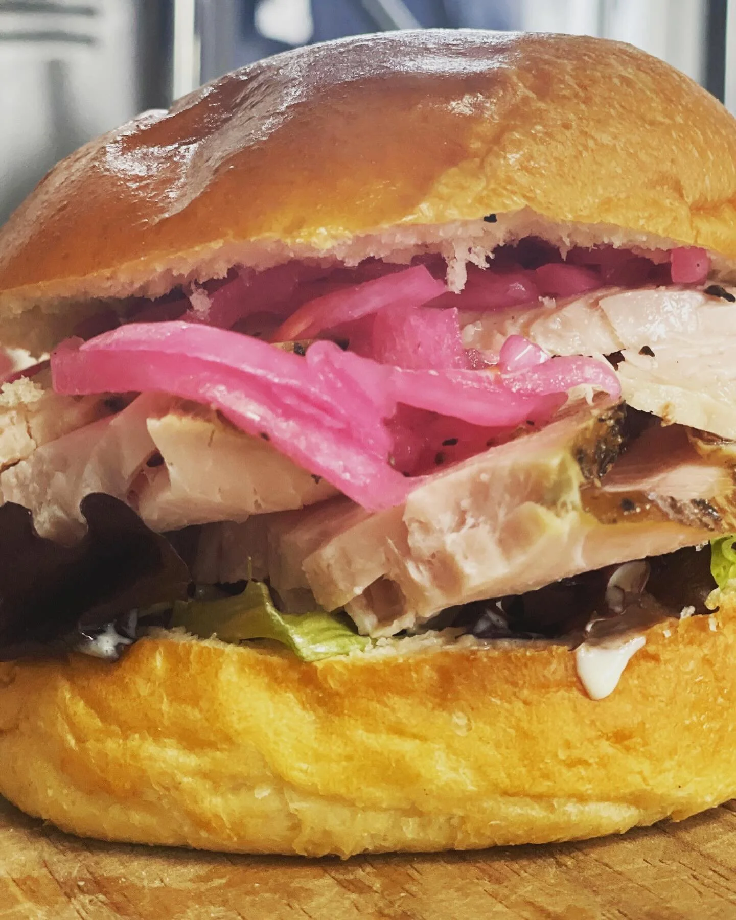 Believe it or not but the team member favorite is our Smoked Turkey Sandwich.  Breast meat we smoke, chill, slice and serve.  We have our own Alabama White Sauce for it topped with picked red onions.  Amazing stuff!  Avail at both locations