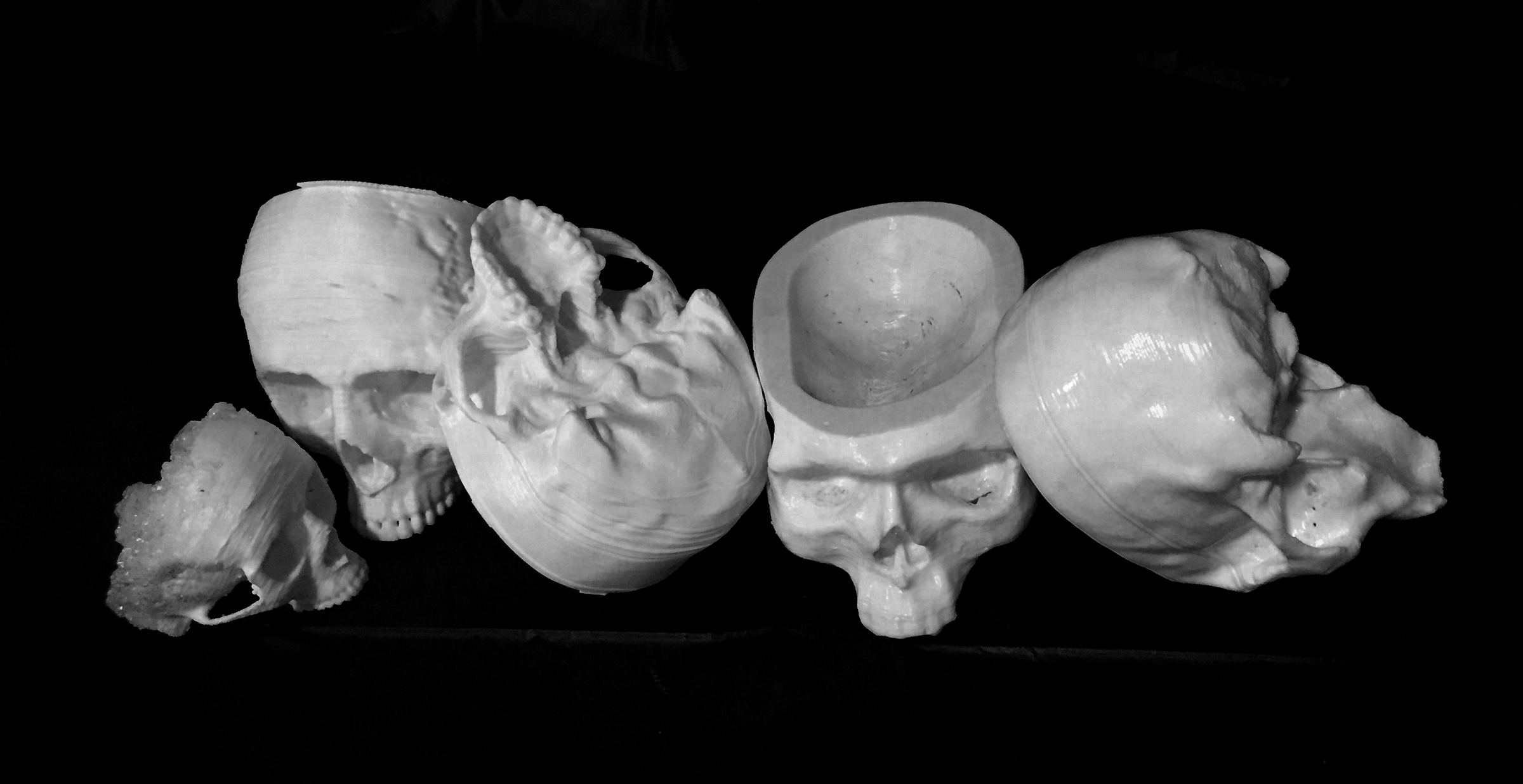 The procession of 3D printed skull prototypes from earliest on the left to latest on the right. 