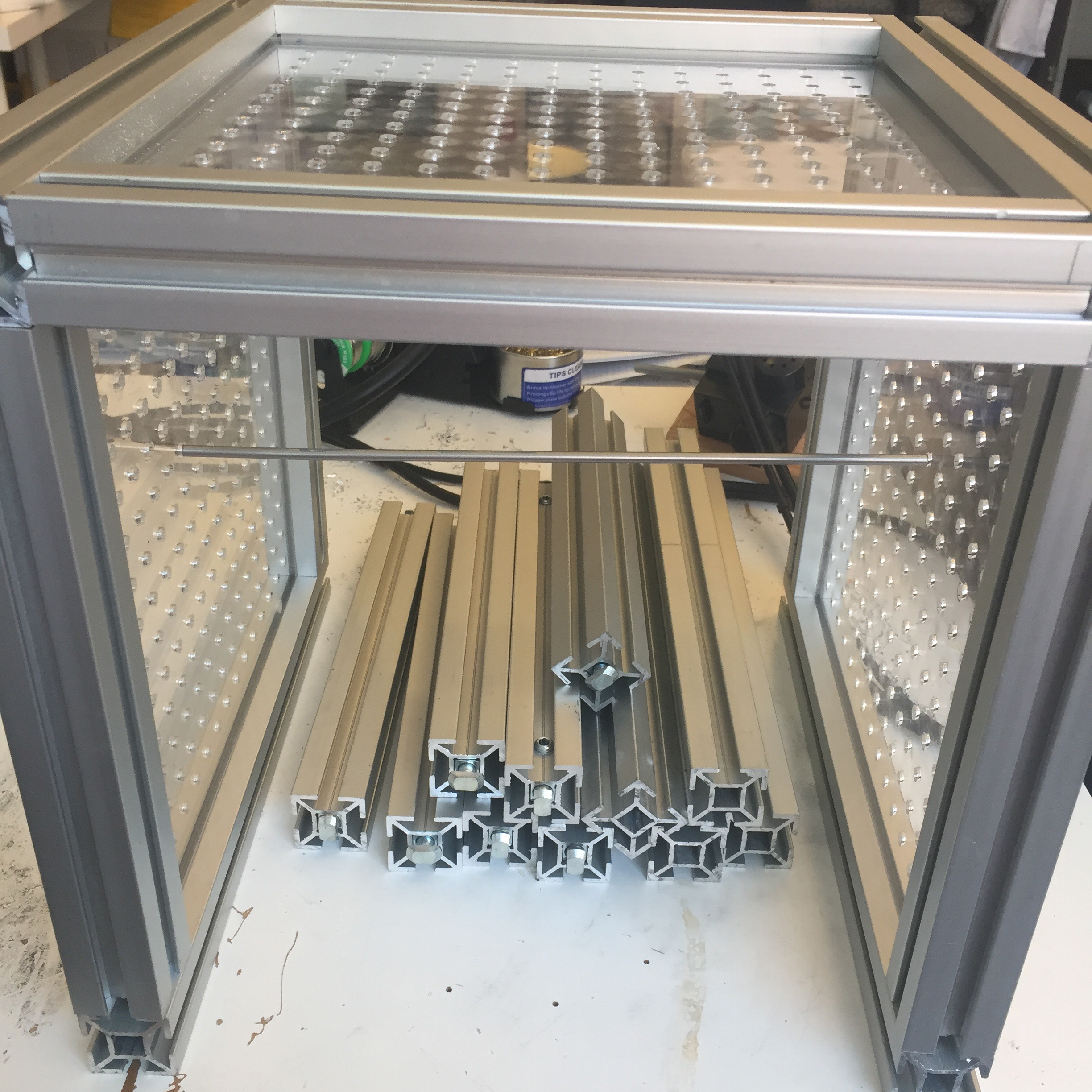 Prototype of a frame for a DIY automata machine. The plexiglass boards were lasercut at a local makerspace and the aluminum frame was designed and crafted by an exhibits developer.