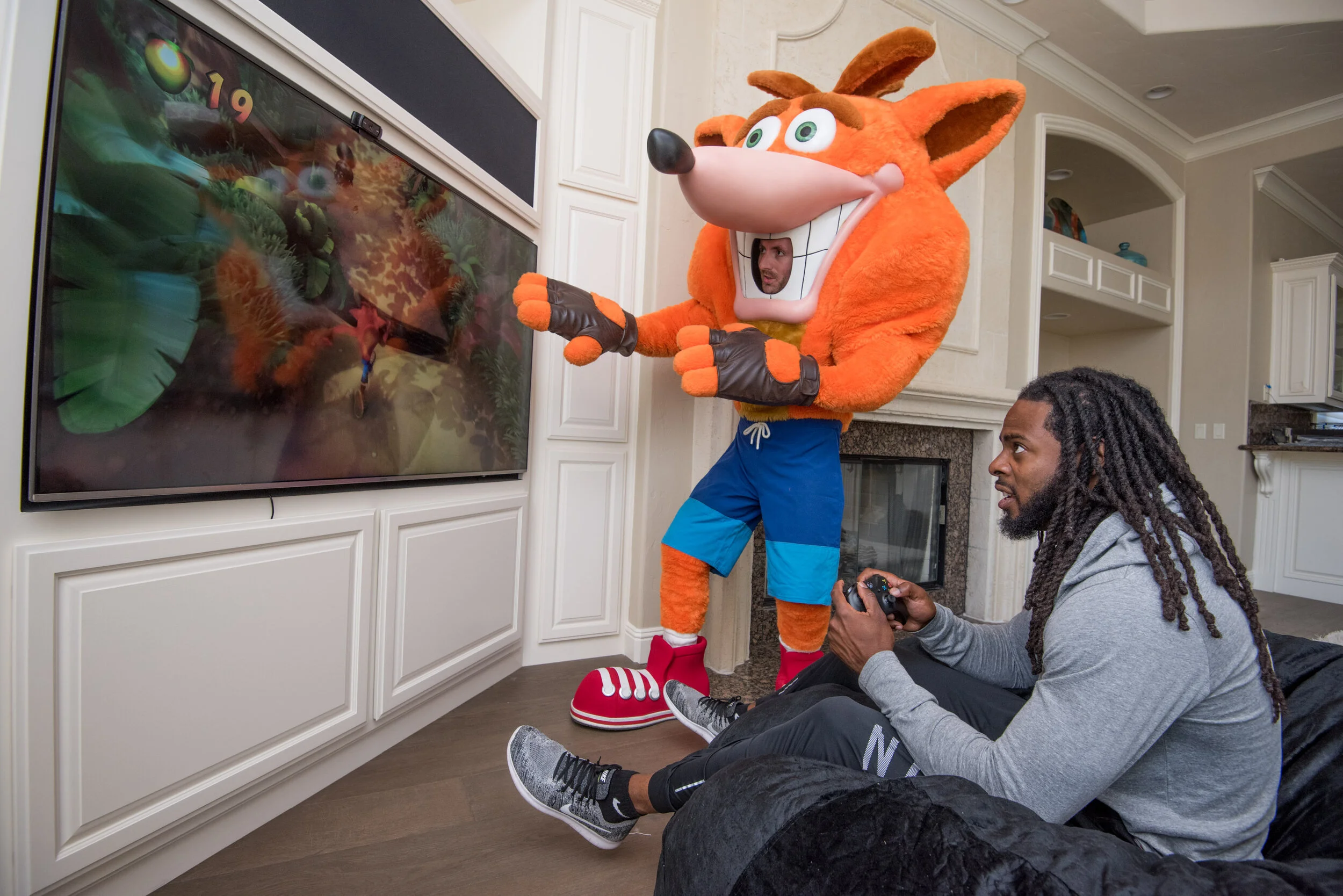   Stanford Alum and San Francisco 49er cornerback Richard Sherman at home with Crash Bandicoot in San Jose, 2018.  