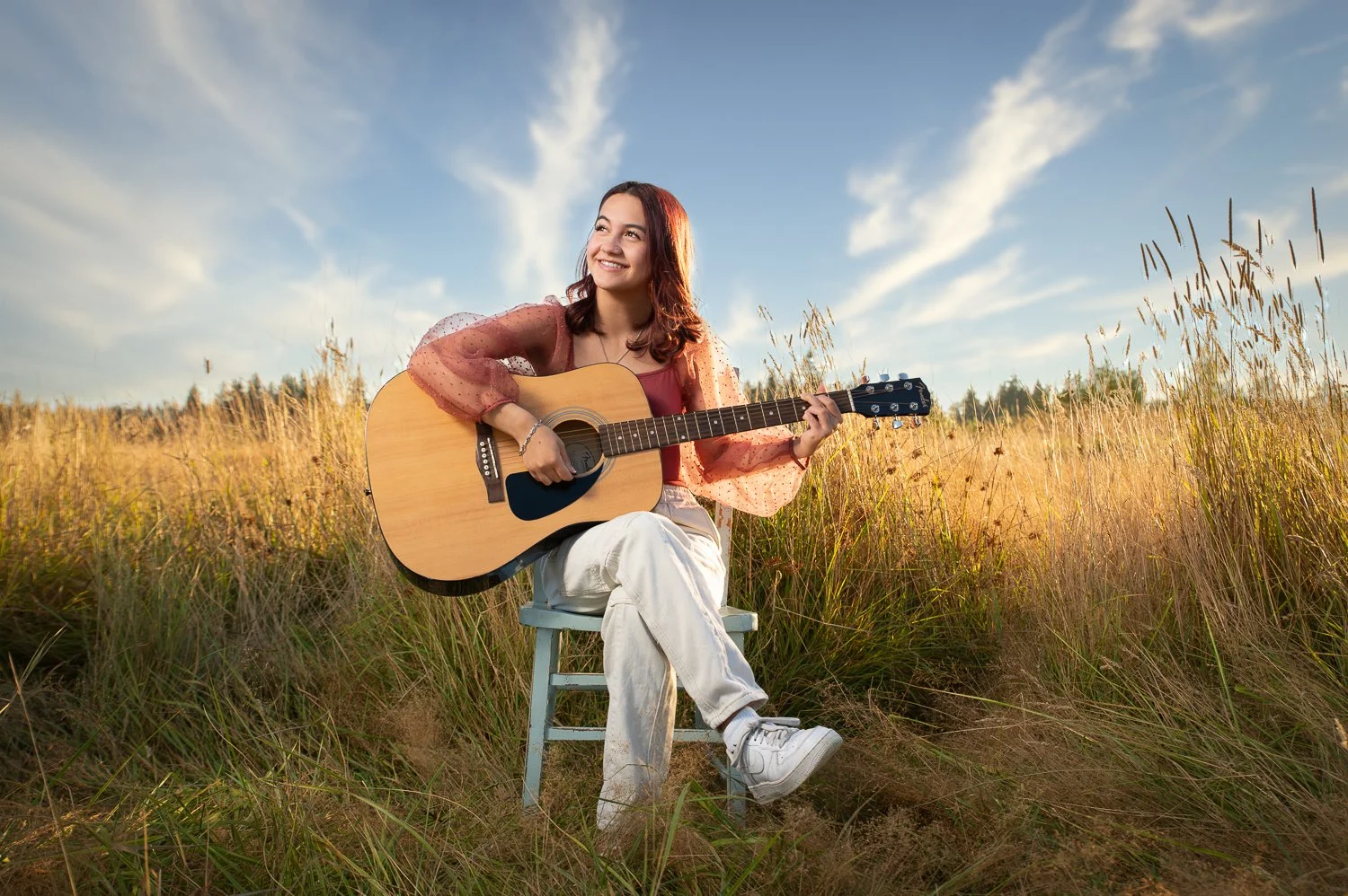 Everett Mill Creek Archbishop Murphy High School senior girl graduate sitting farm field with guitar