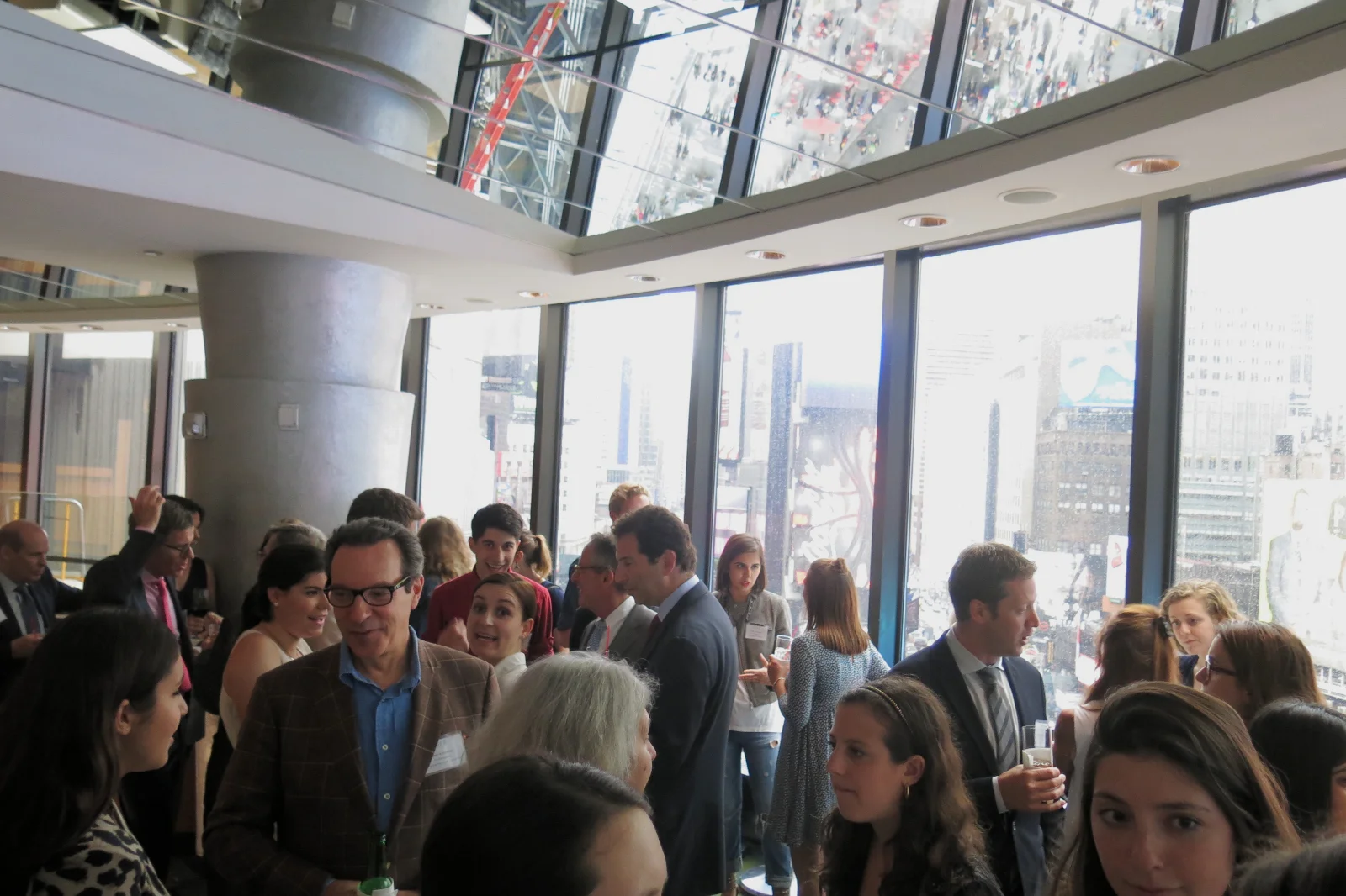 YMA FSF Scholars, Board members and executives conversing over hors d'oeuvres in the Broadway Lounge.