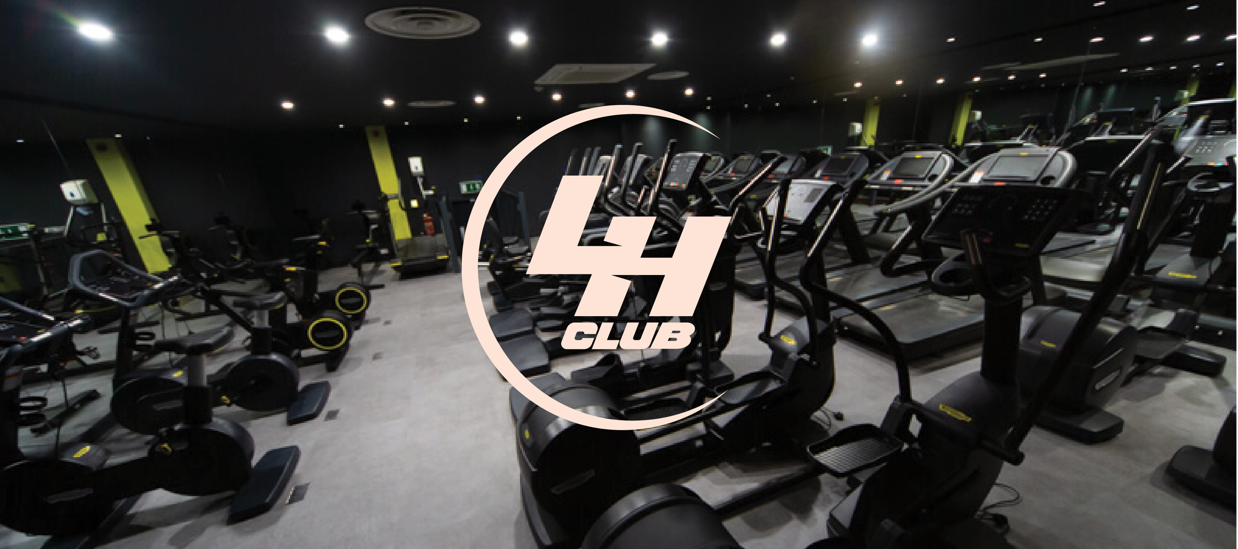 Empty gym room with black treadmill and elliptical machines, logo with the text 'GYM CLUB' overlaid in the center.