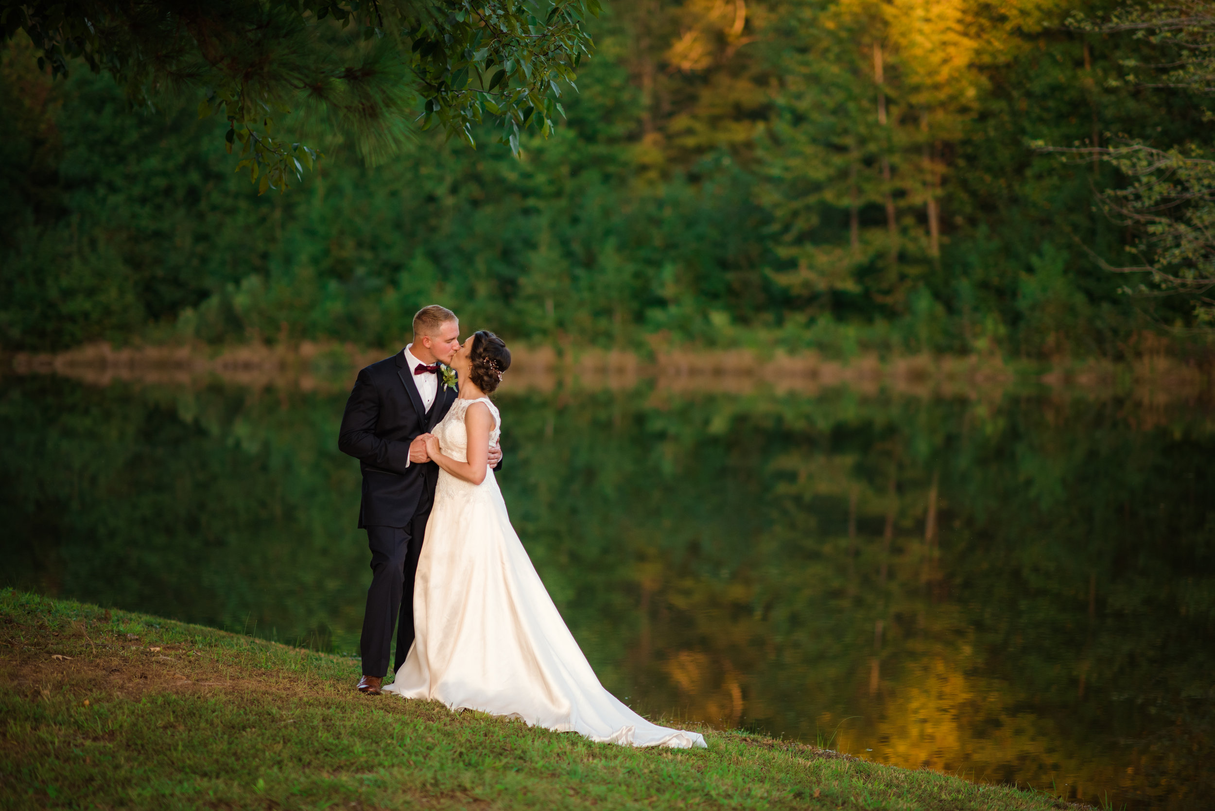 brittany and matt fall portait by the water longways.jpg