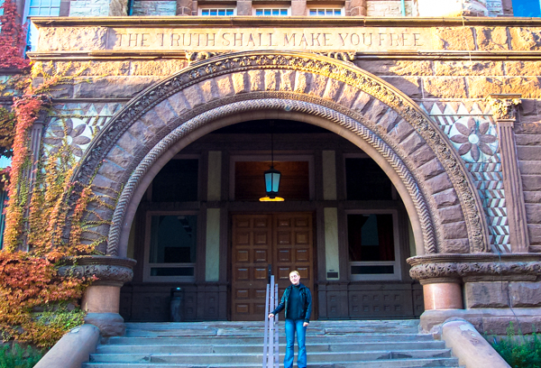 This was me at my alma mater, University of Toronto. I was still keeping my stories secret. Notice the words imprinted on the building overhead.