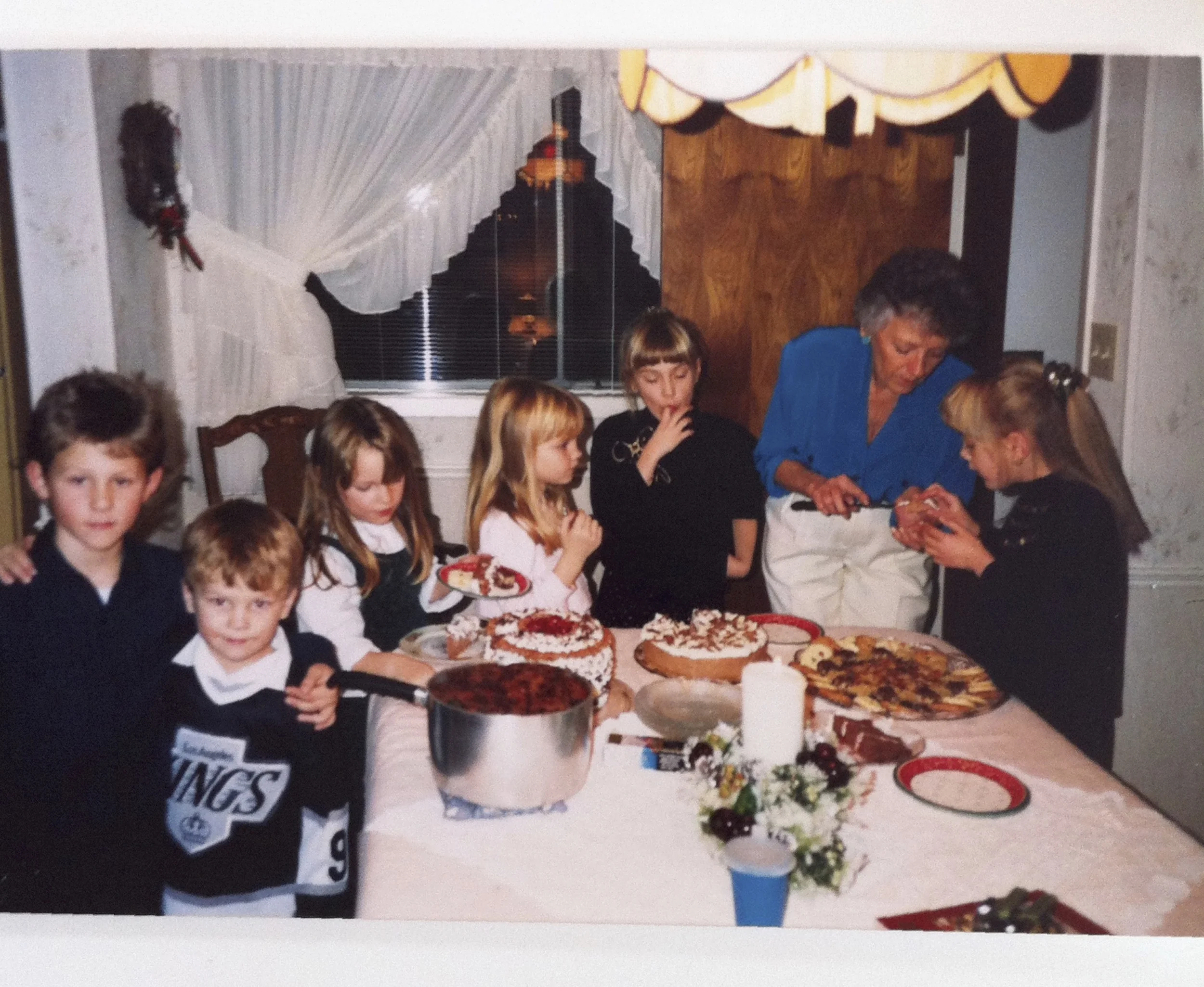 My Grandma, Joanne, serving up tasty desserts to me and my cousins, 'back in the day'. I'm the one who can't stop herself from tasting the food.