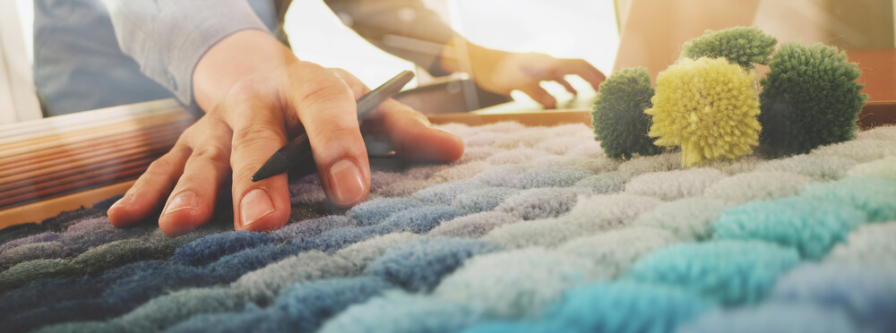 designer picking carpet.jpg