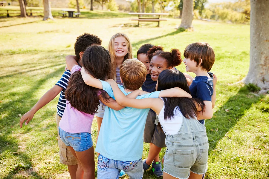bigstock-A-group-of-school-kids-in-a-hu-258026437.jpg