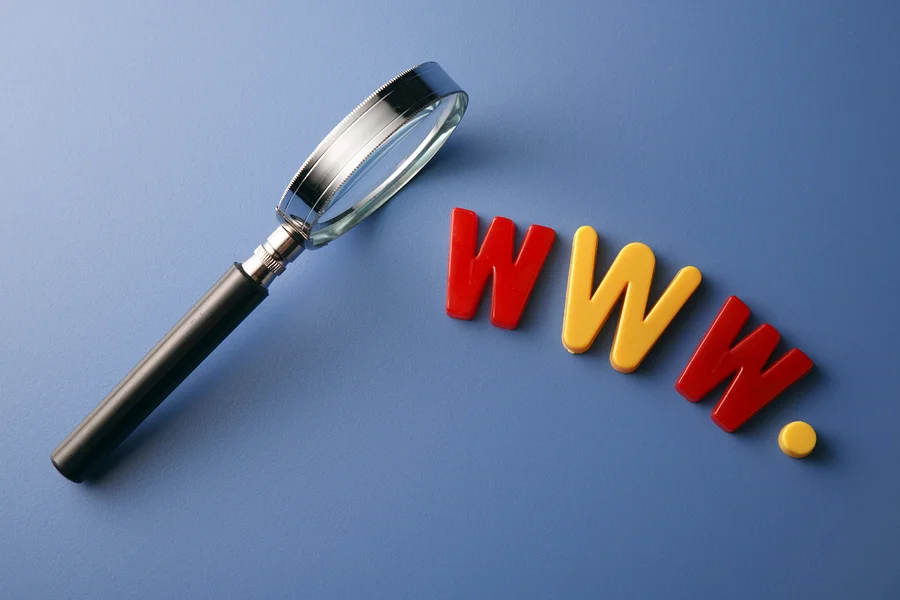 bigstock-Magnifying-glass-beside-the-wo-26767466.jpg