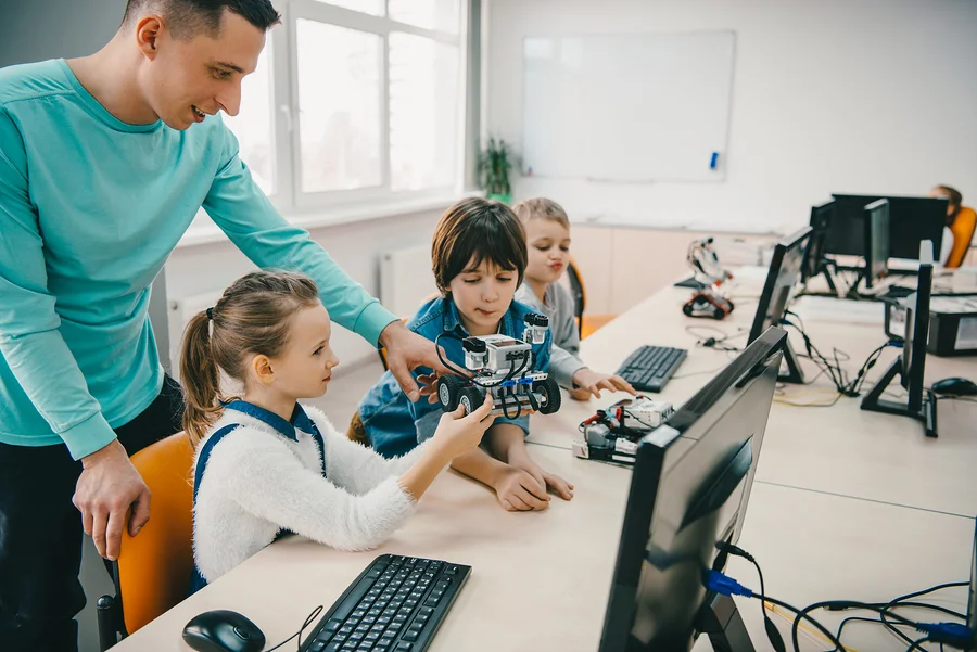bigstock-Teacher-Helping-His-Teen-Stude-232130881.jpg