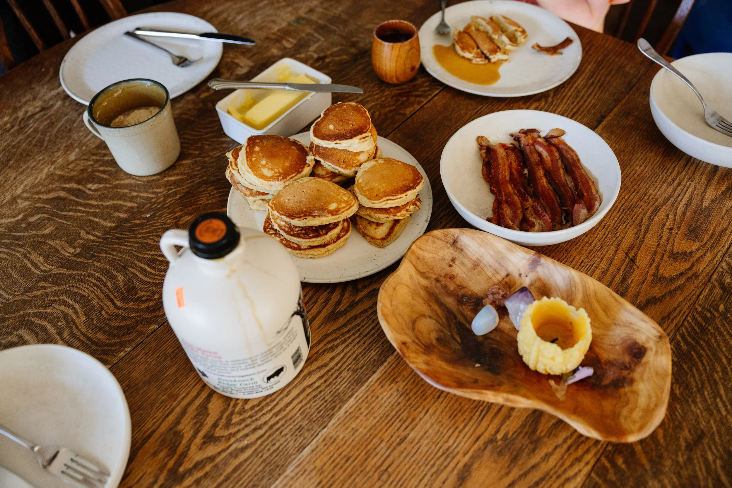 Details of a table with breakfast set out during an at home photography session. Photography by Sienna Renee Photography.