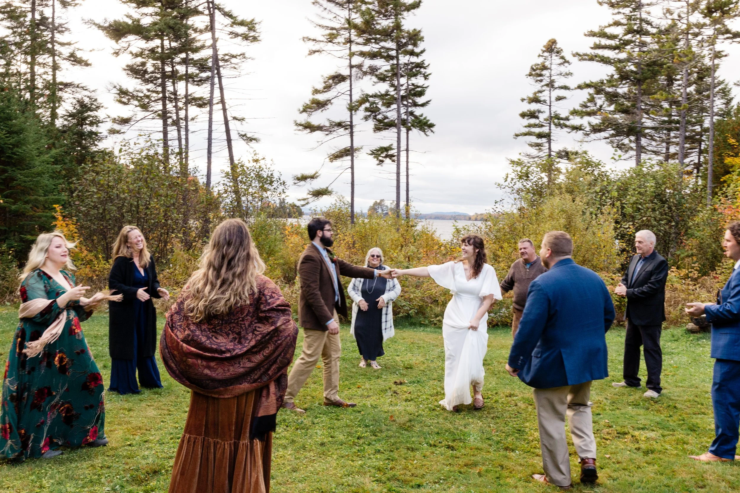 A couple dances together during their intimate wedding in Maine.