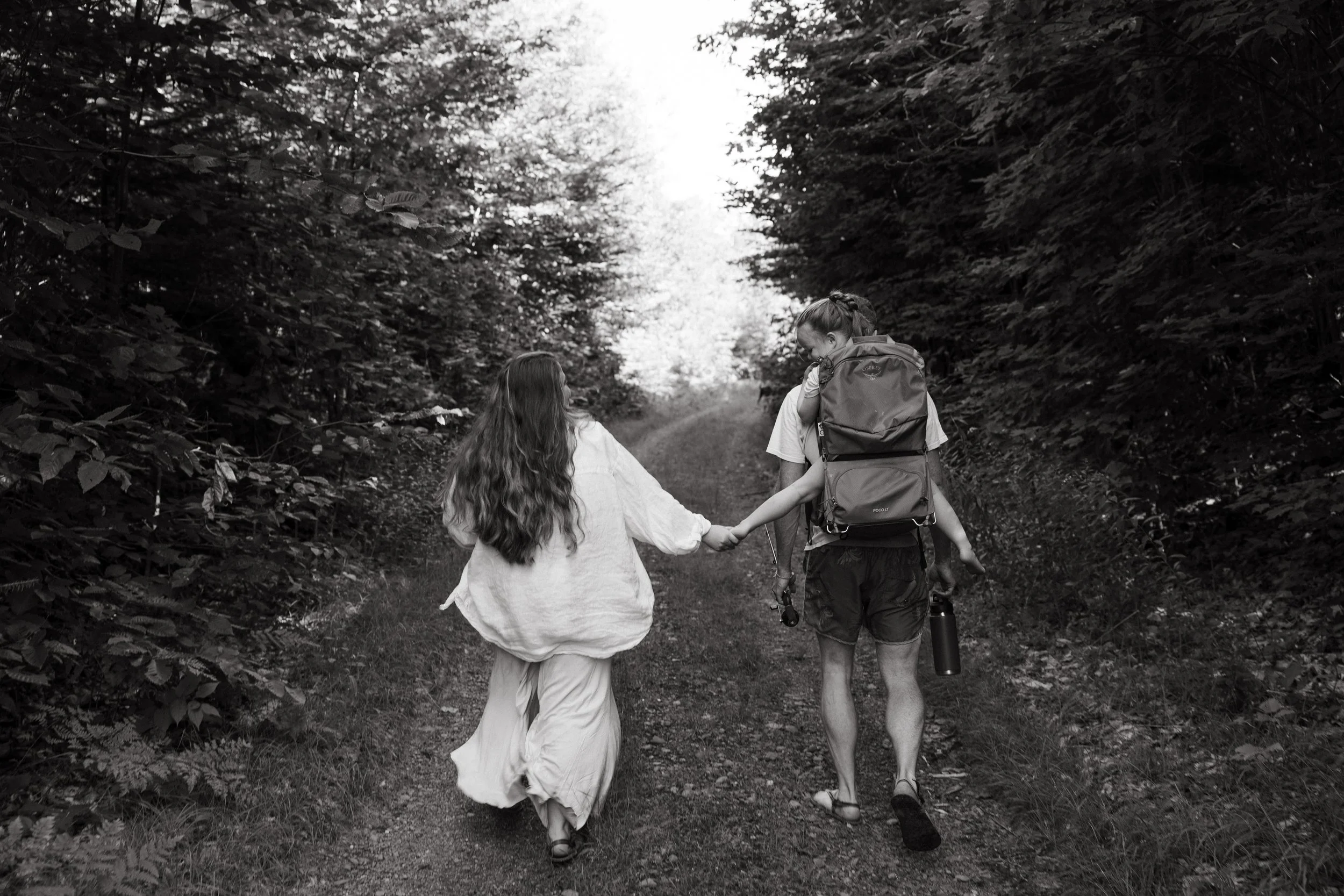 A family walks on trail together in Monson, Maine. Photography by Sienna Renee Photography.