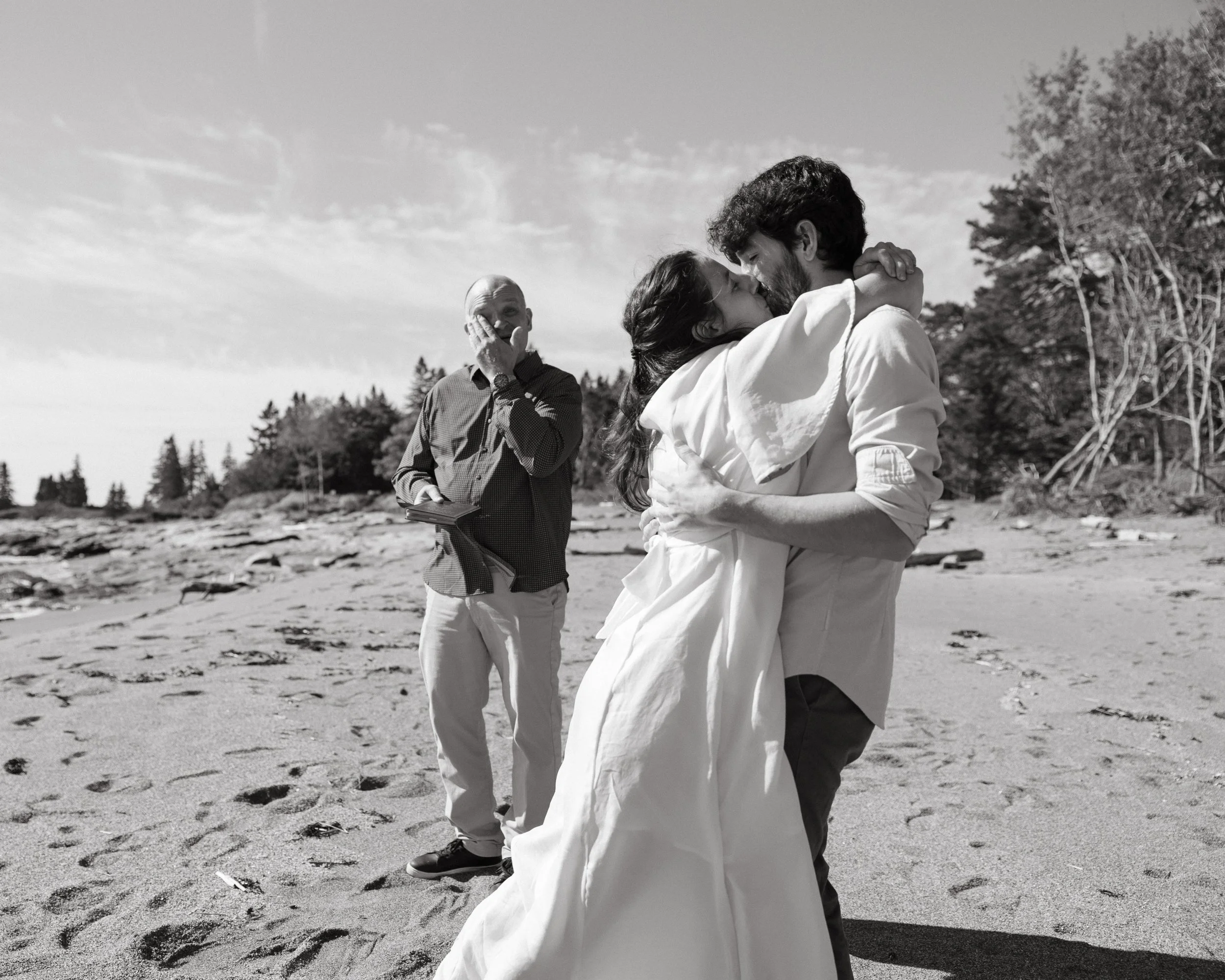 A couple during their small wedding day at Reid State Park in Georgetown, Maine. Photography by Sienna Renee Photography.