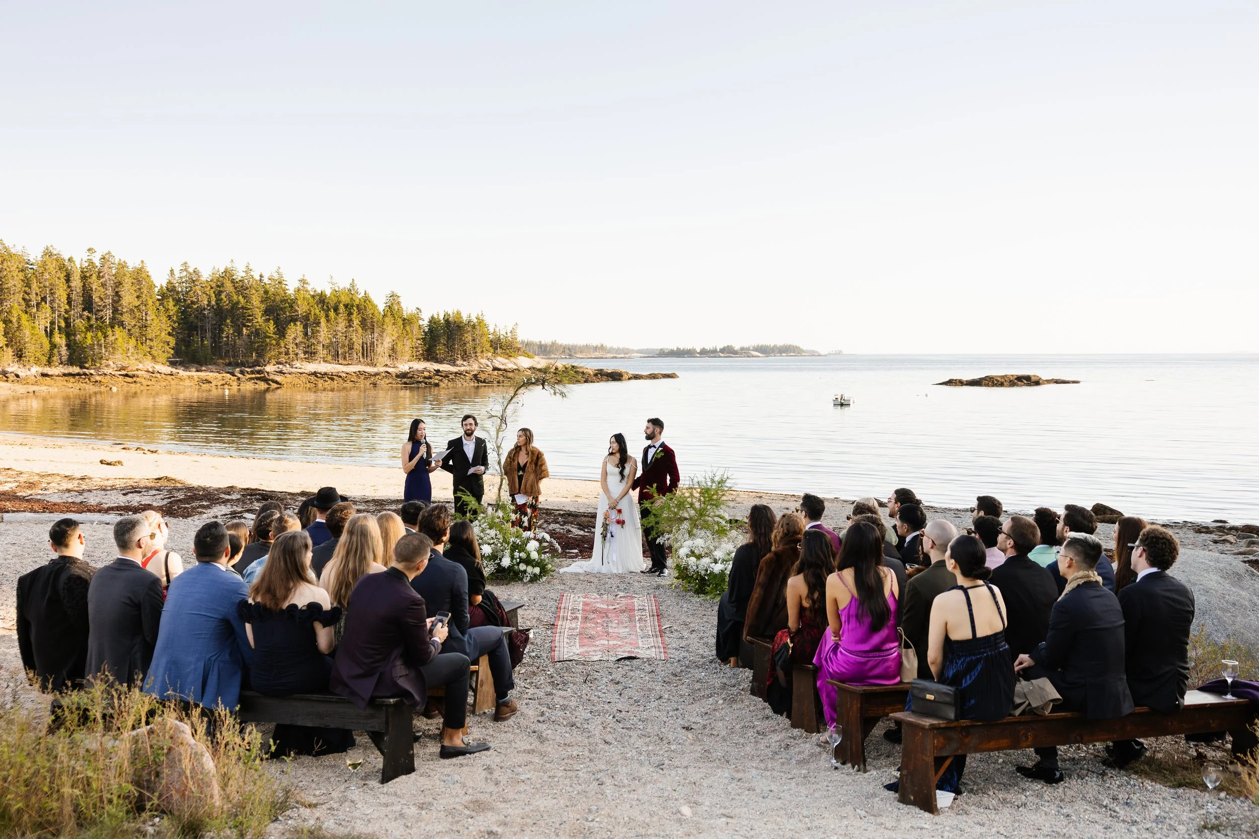 A ceremony during an intimate wedding weekend at Aragosta at Goose Cove in Deer Isle, Maine. Photography by Sienna Renee Photography.