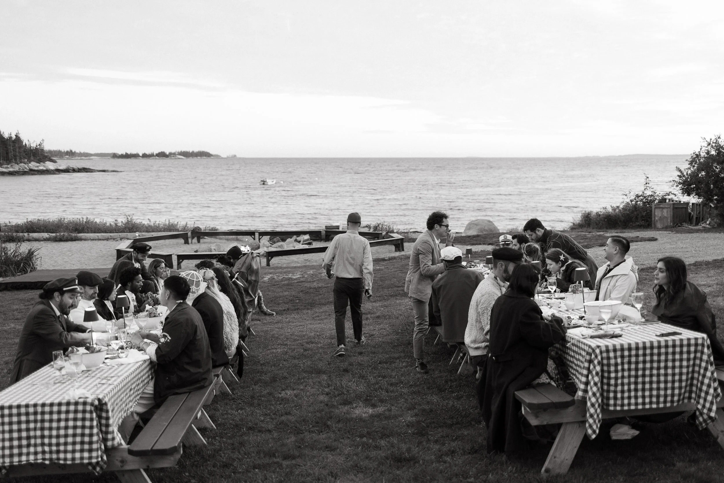 A welcome dinner during an intimate wedding weekend at Aragosta in Deer Isle, Maine. Photography by Sienna Renee Photography.
