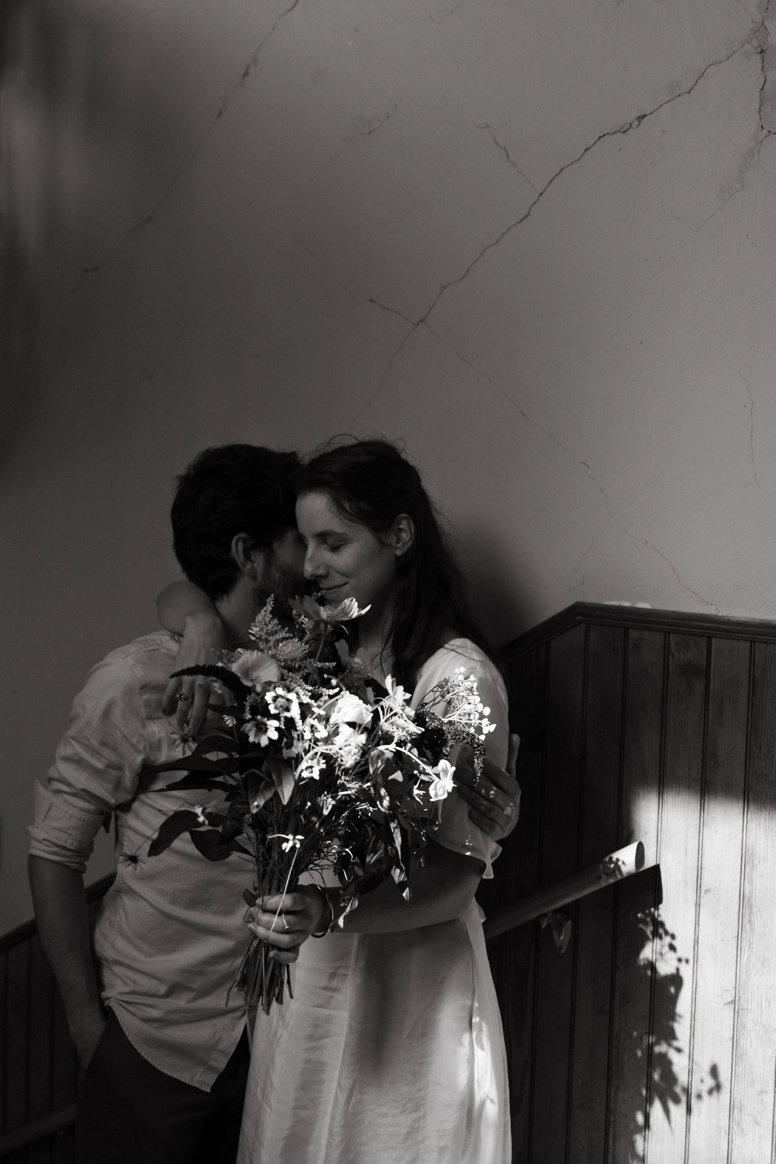 A couple stands in the light after just getting married during their small wedding at Reid State Park, Maine. Photography by Sienna Renee Photography.