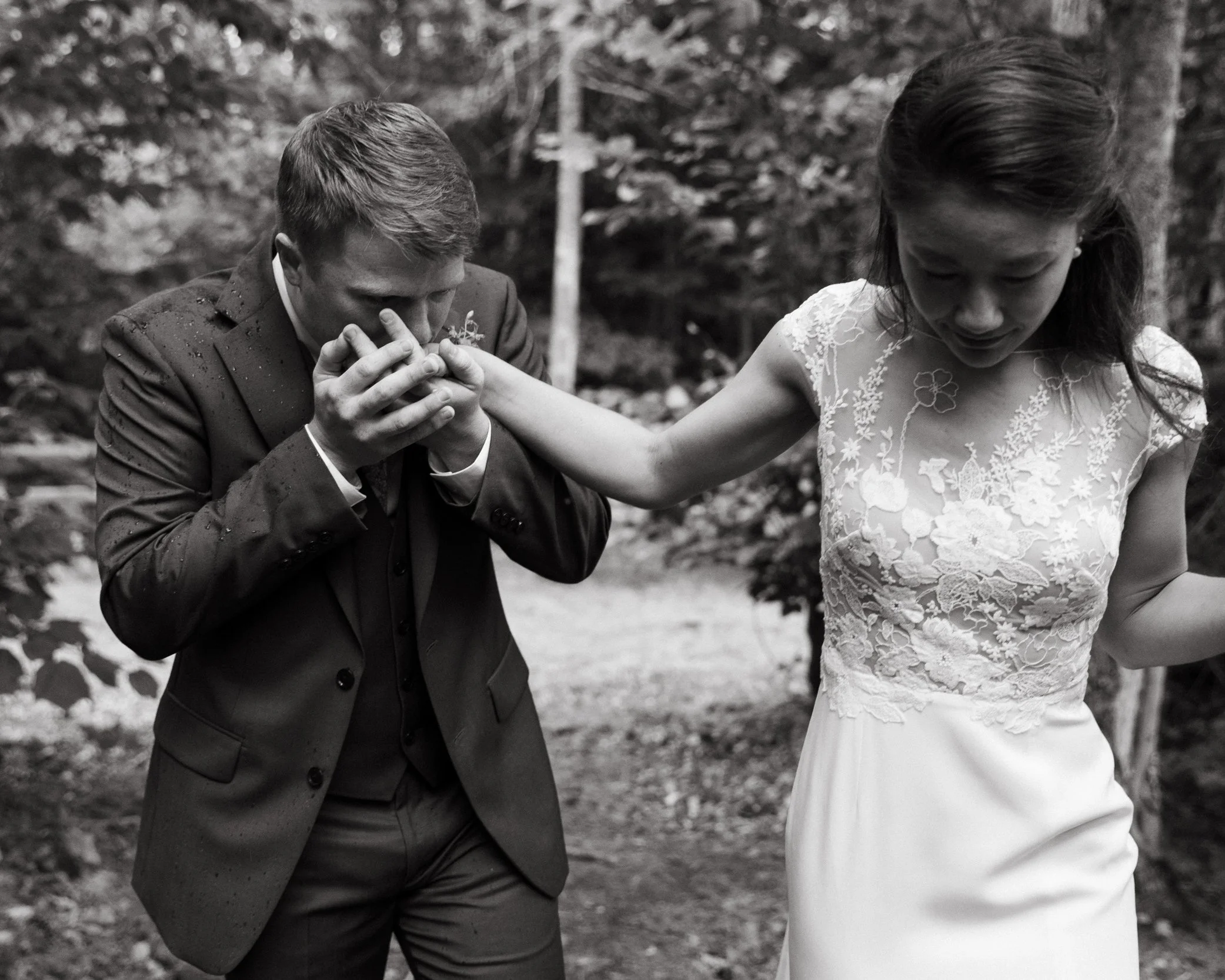 A couple walking together during their non-traditional backyard wedding in Maine. Photography by Sienna Renee Photography.