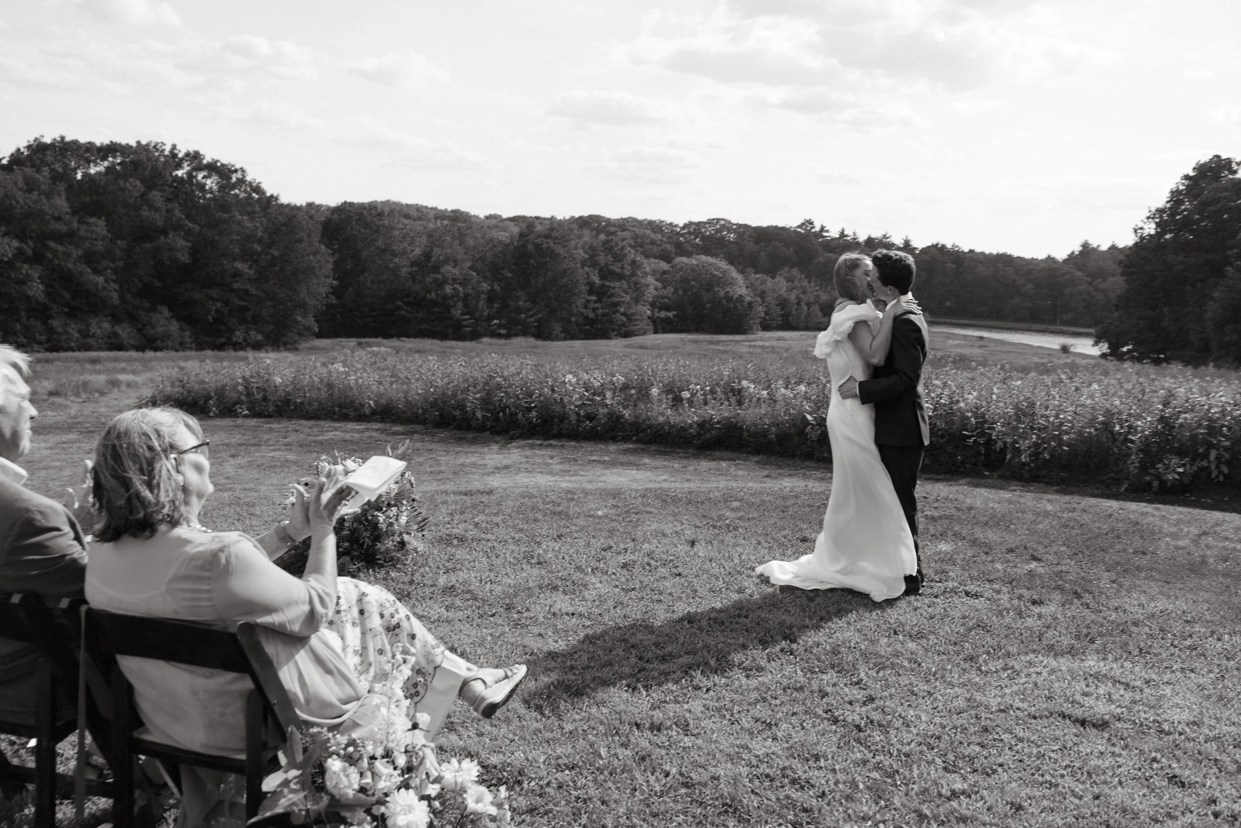 A couple during their ceremony at Scotland Fields in Maine. Photography by Sienna Renee Photography.