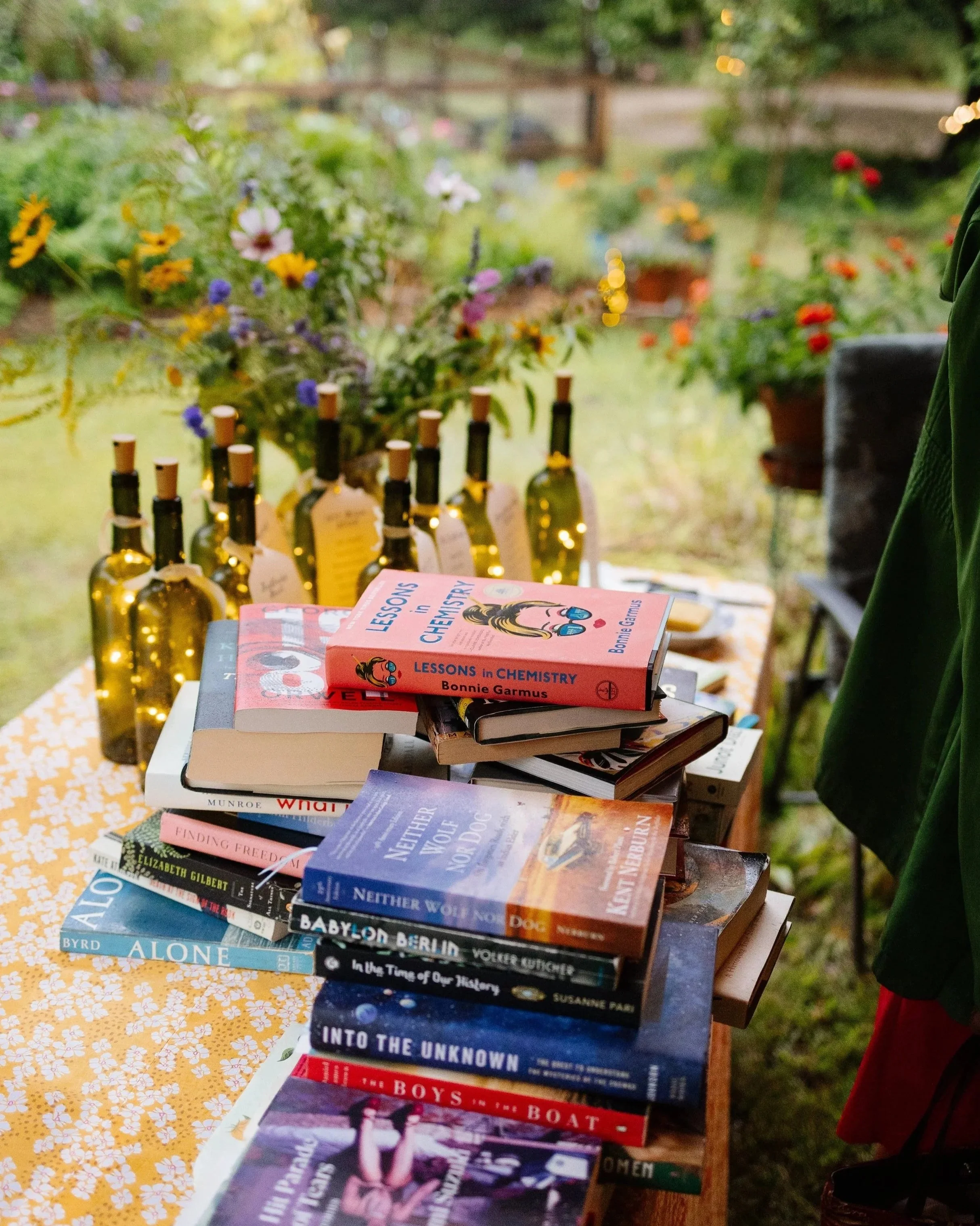 Details of a book swap during an intimate wedding on a family property in Maine. Photography by Sienna Renee Photography.