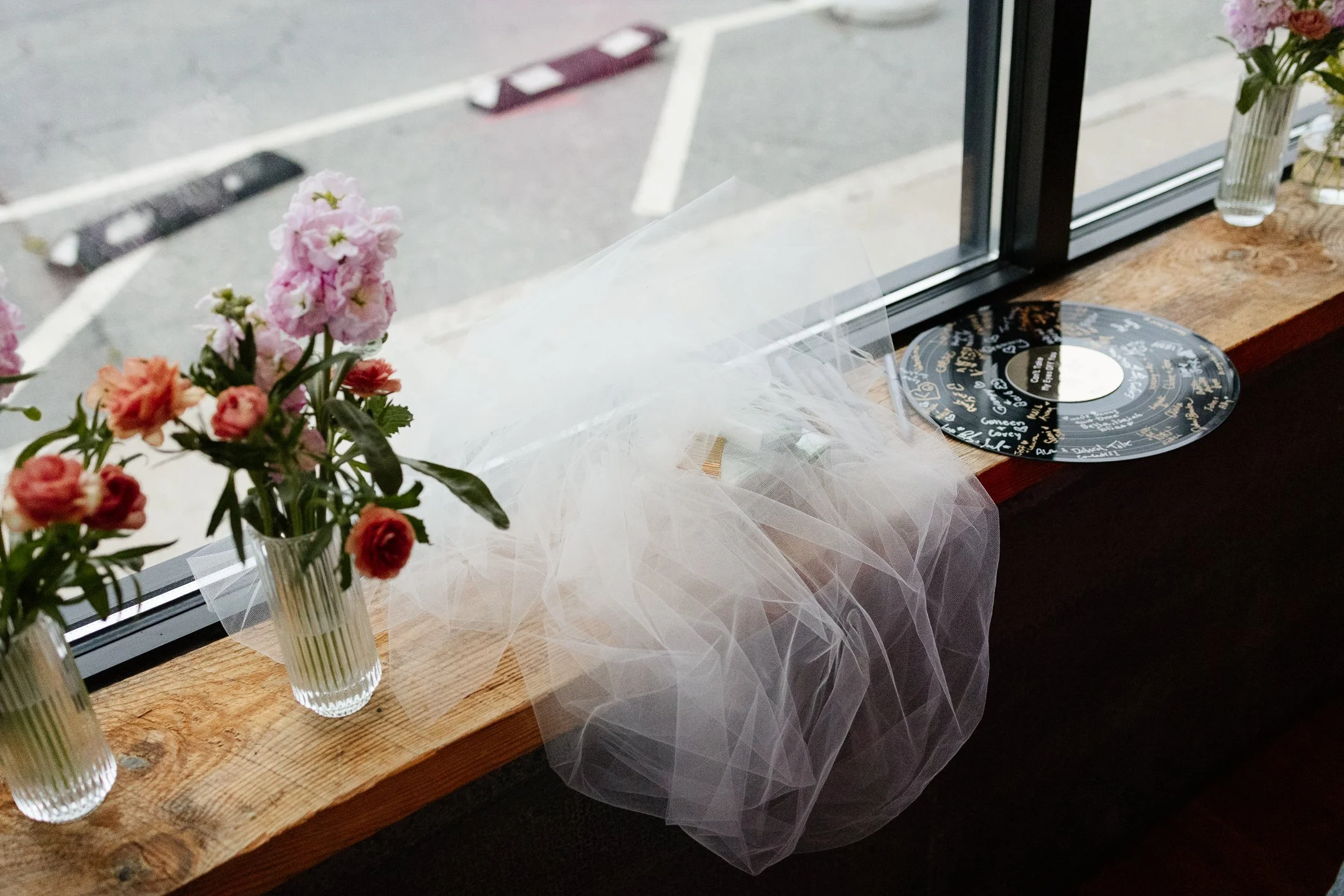A veil on a window sill during an intimate wedding in Massachusetts. Photography by Sienna Renee Photography.
