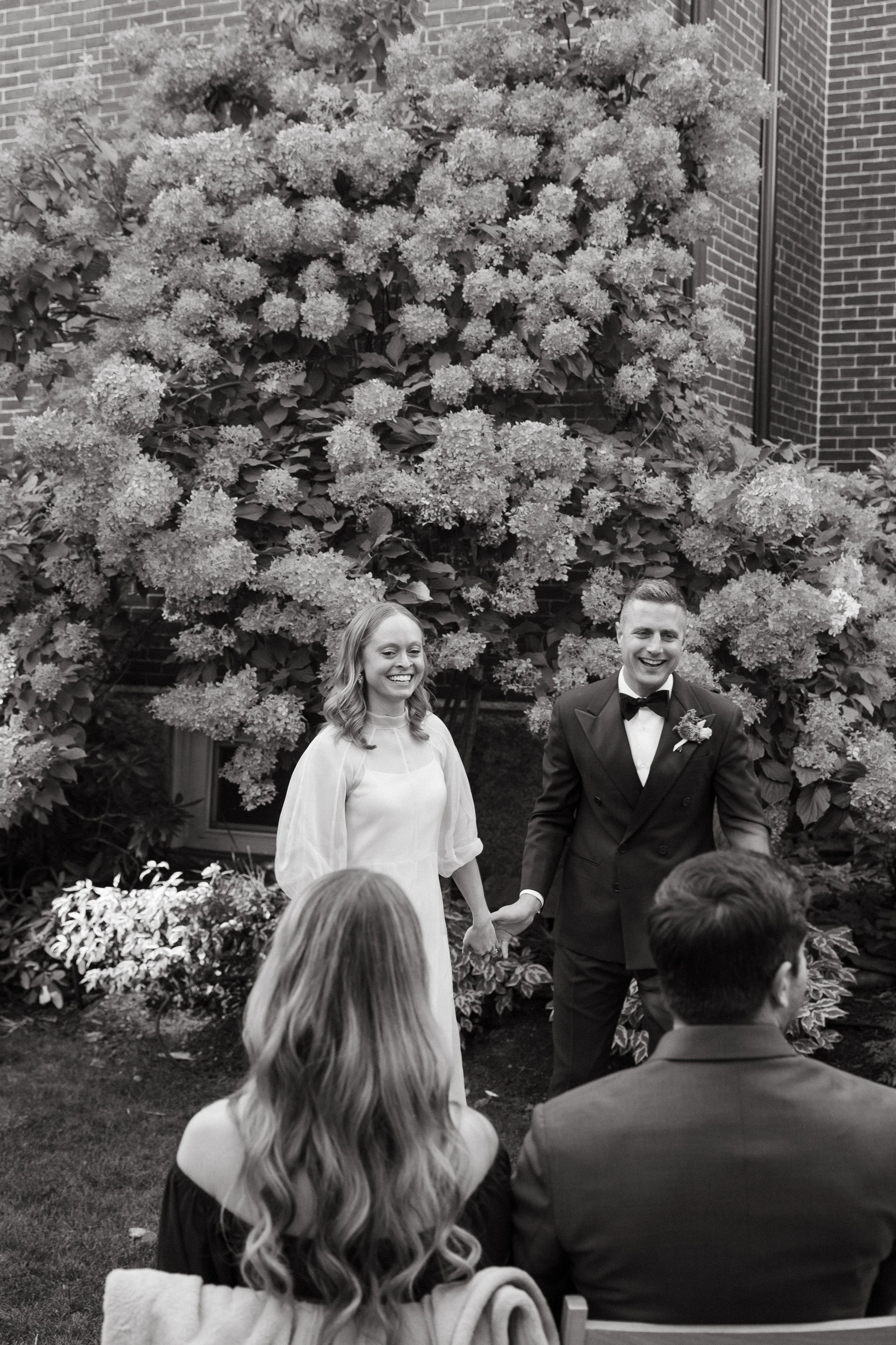 An intimate wedding in the courtyard of The Thomas Delano House in Portland, Maine. Photography by Sienna Renee Photography.