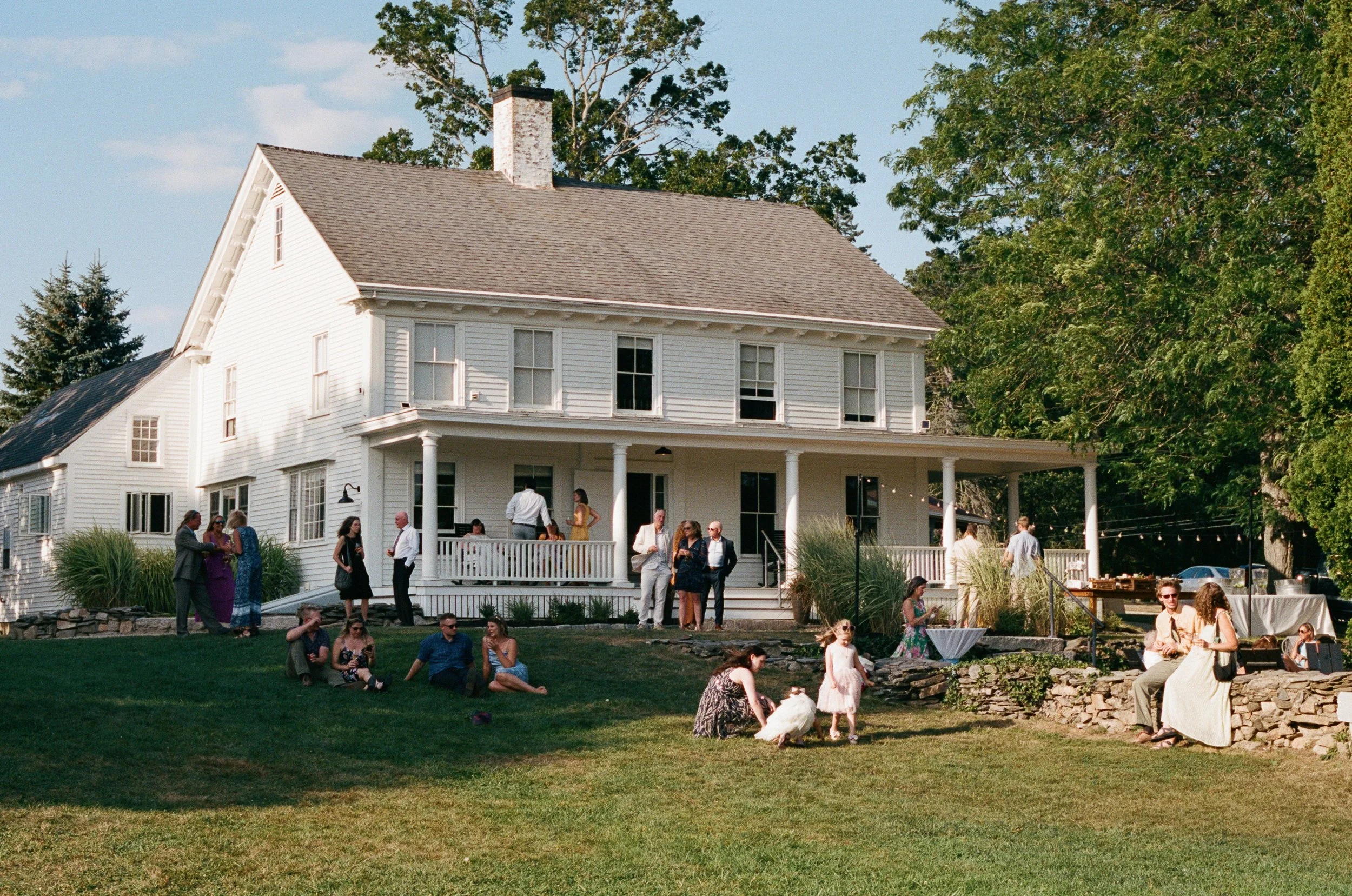 Guests enjoying Scotland Fields, an intimate wedding venue in York, Maine. Photography by Sienna Renee Photography.