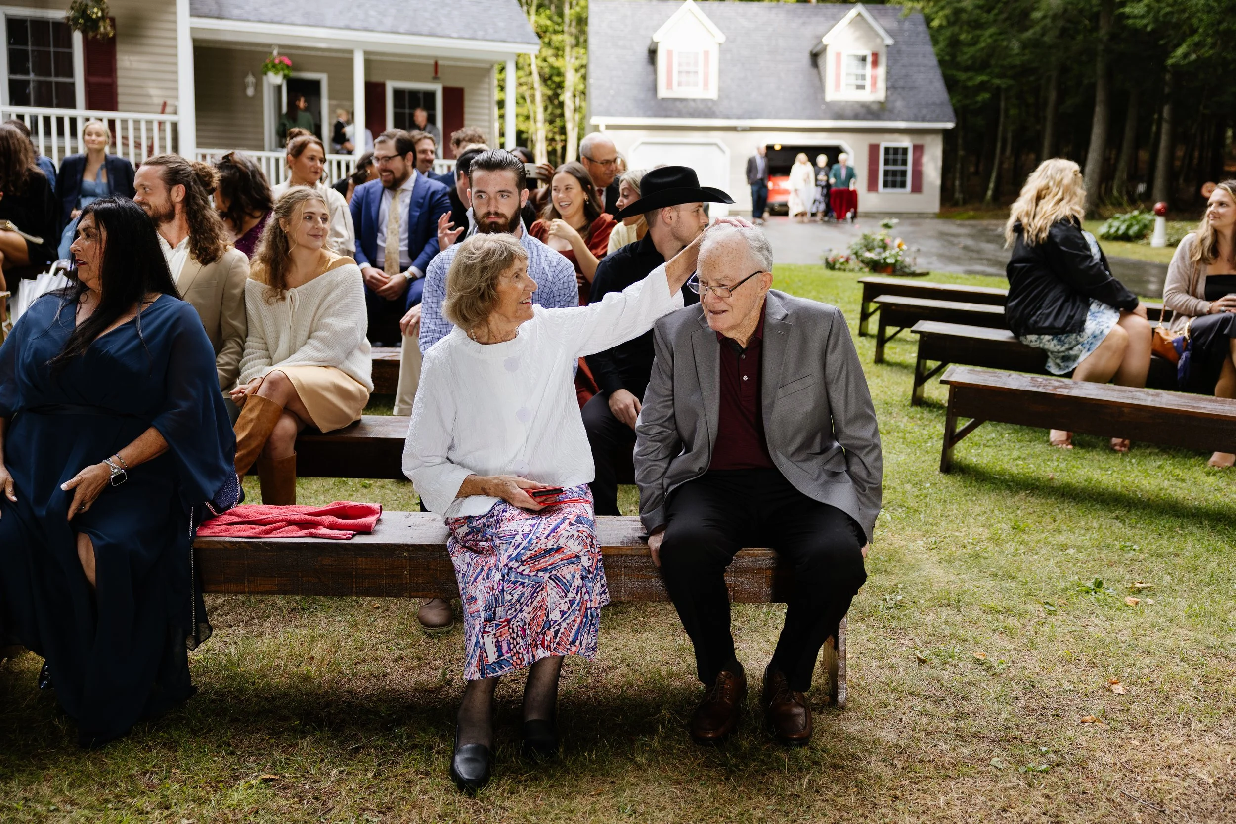 Guests during an intimate backyard wedding in Palmyra, Maine. Photography by Sienna Renee Photography.