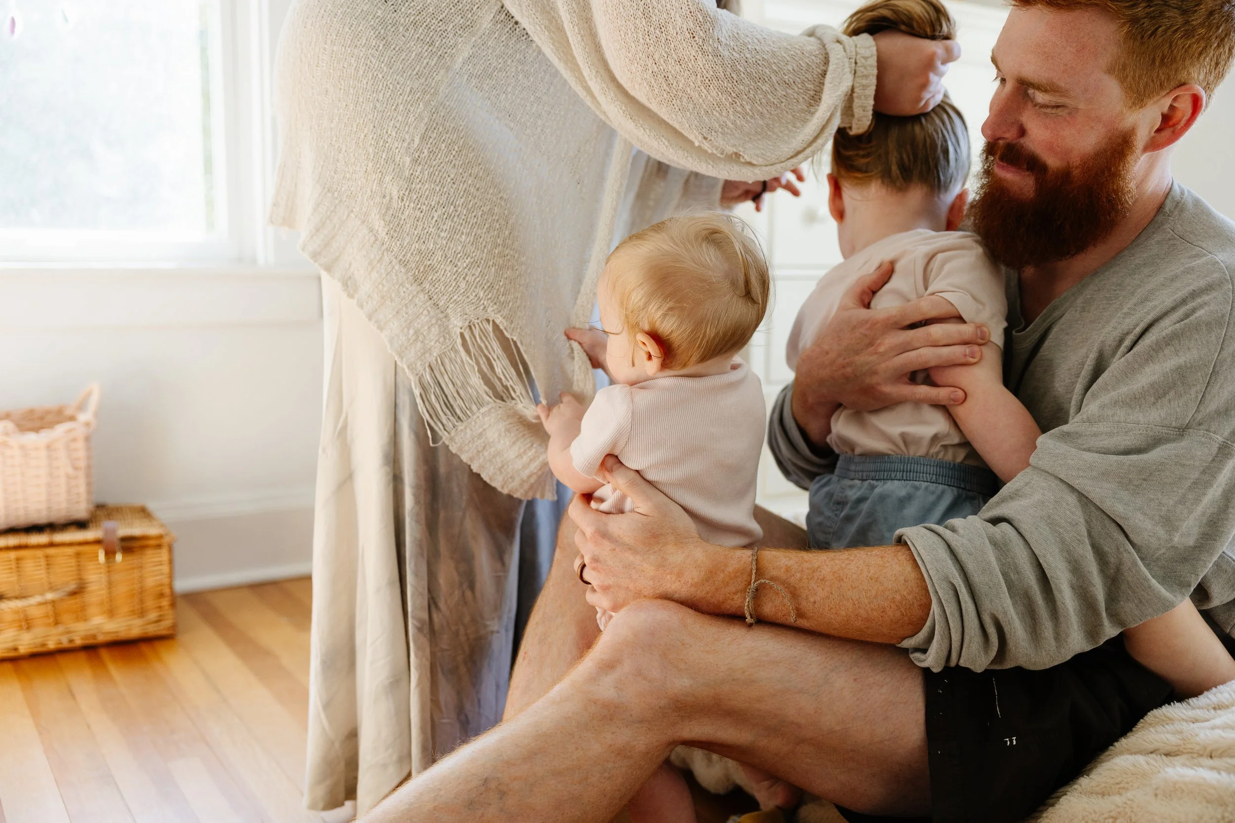 Parents get their kids dressed for the day at home in Maine. Photography by Sienna Renee Photography.