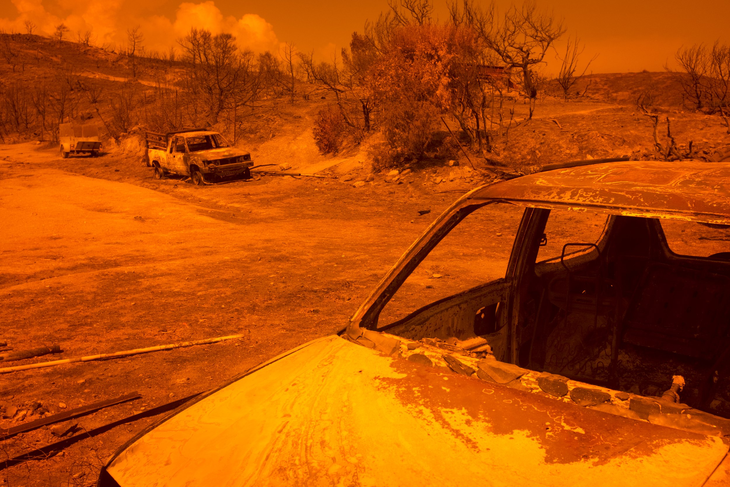  Burnt out cars after the wildfires on Rhodes 