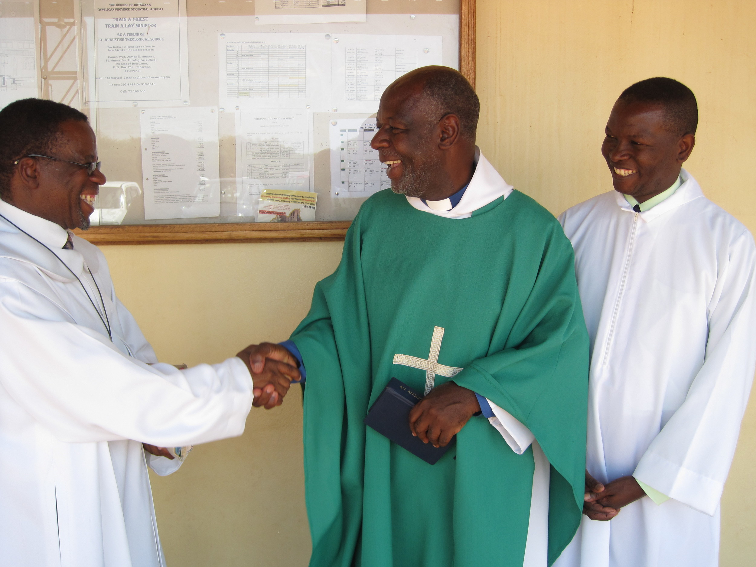  Ordinands Octavius Bolelang (left) and Bashie Tsheole with Fr. Andrew Mudereri