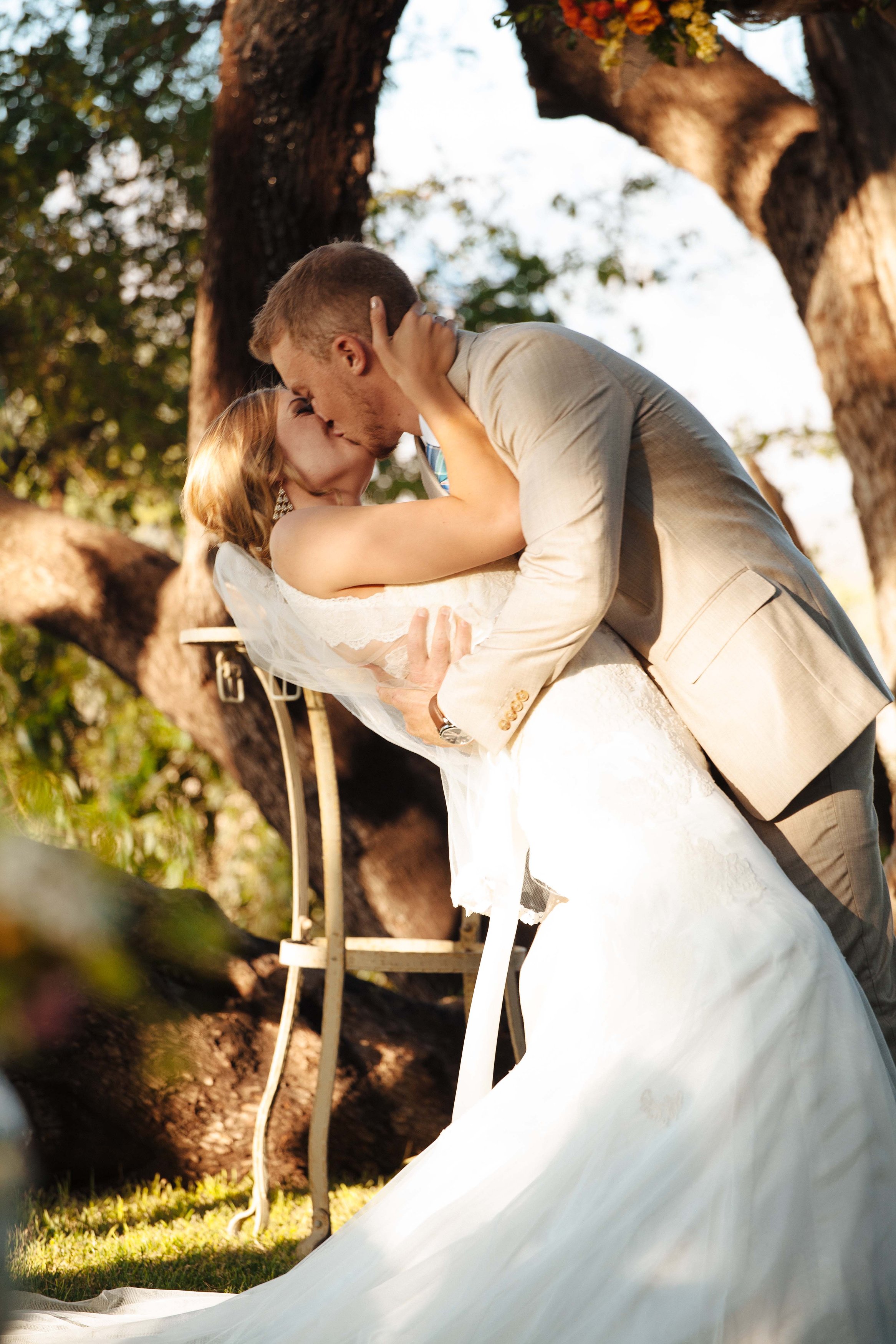 Premium Photo | Beautiful wedding couple poses on a green field in the rays  of sunset