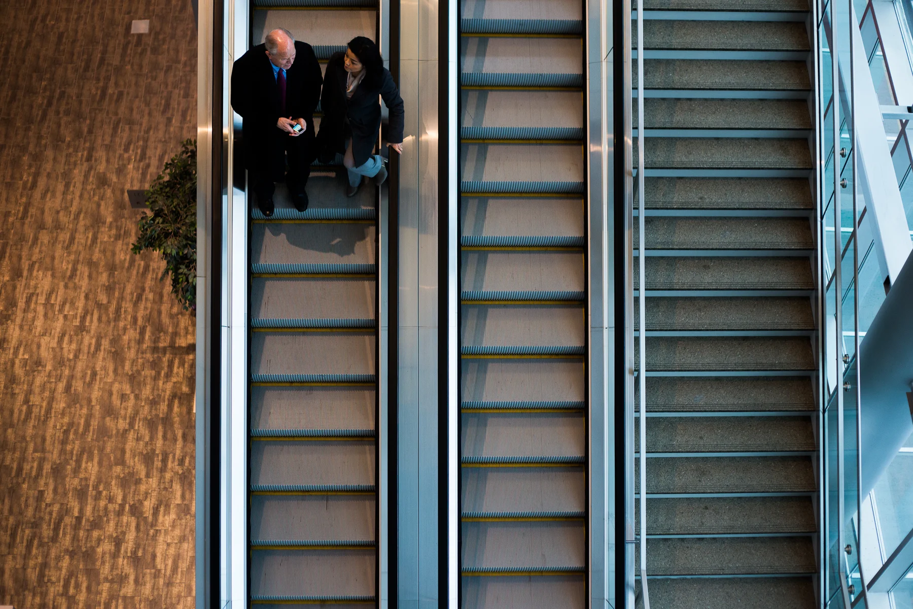 Alaska Governor Elect Bill Walker (left) and Spokesperson Grace Jang left the Dena'ina Center after Walker gave remarks and mingled with attendees at the 35th annual Alaska Resources Conference in Anchorage, Alaska on Thursday, November 20, 2014.
