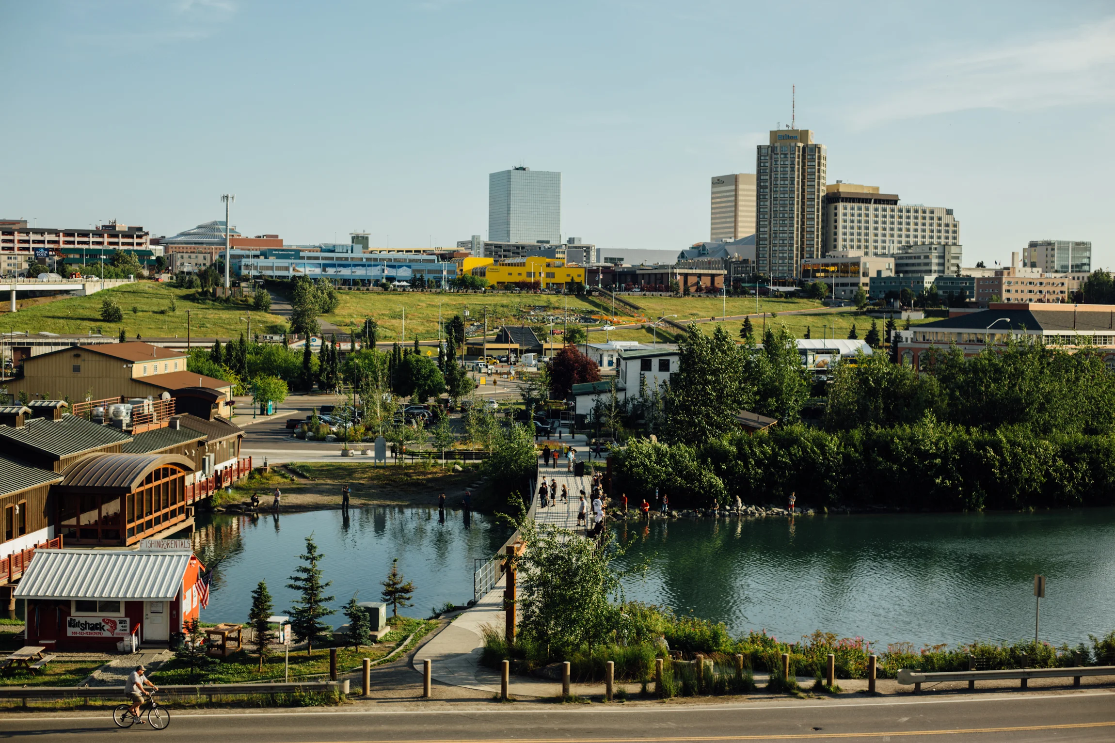 Ship Creek draws tourists and anglers fishing for salmon mere footsteps from downtown Anchorage, Alaska.