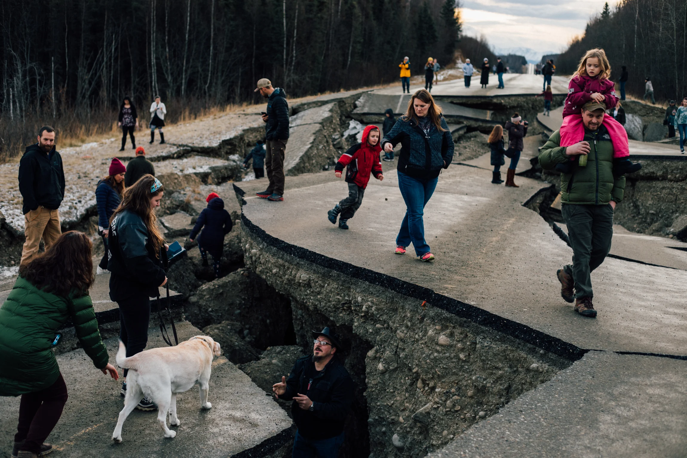 Residents of Wasilla, Alaska, exploring the earthquake damage to Vine Road on Sunday, Dec 2. The 7.0 magnitude quake that struck on Friday was centered nearby. For the New York Times