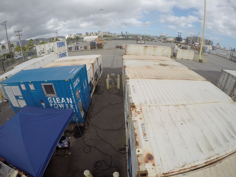 The generator (pictured on the left) was used to power up to 10 refrigerated containers at a time. Source: Sandia National Laboratories