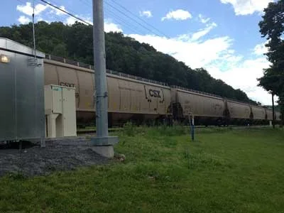 A Plug Power GenSure fuel cell backup power generator (left) on a stretch of CSX railroad. Source: Plug Power