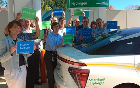 Air Products employees with National Hydrogen & Fuel Cell Day signs for 2017