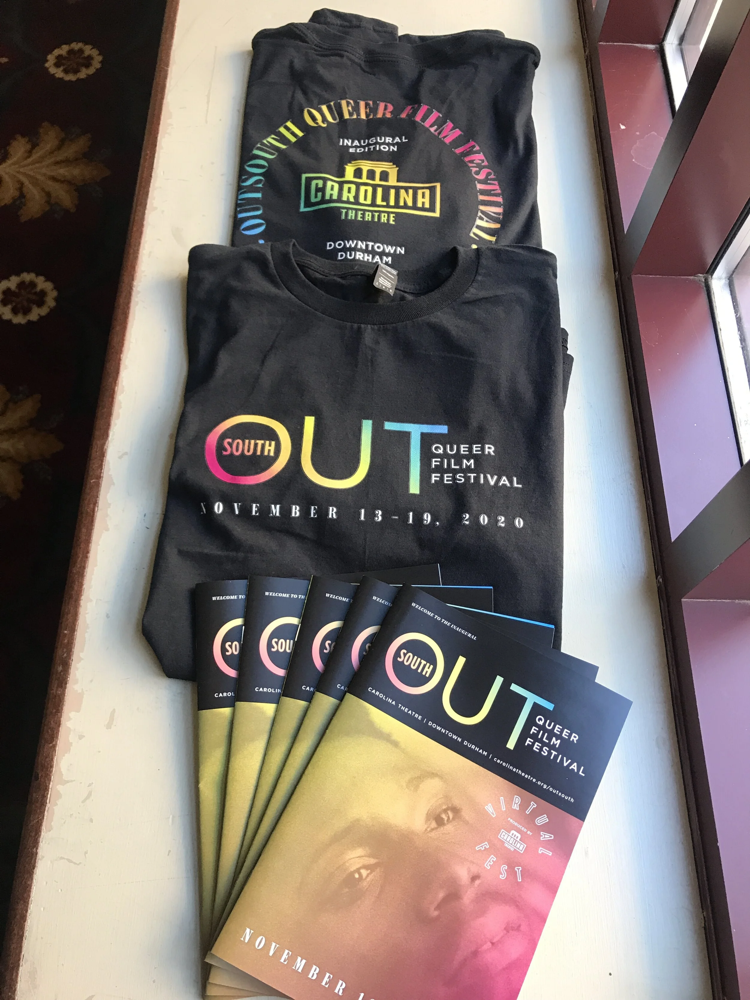 T-shirts and festival booklets