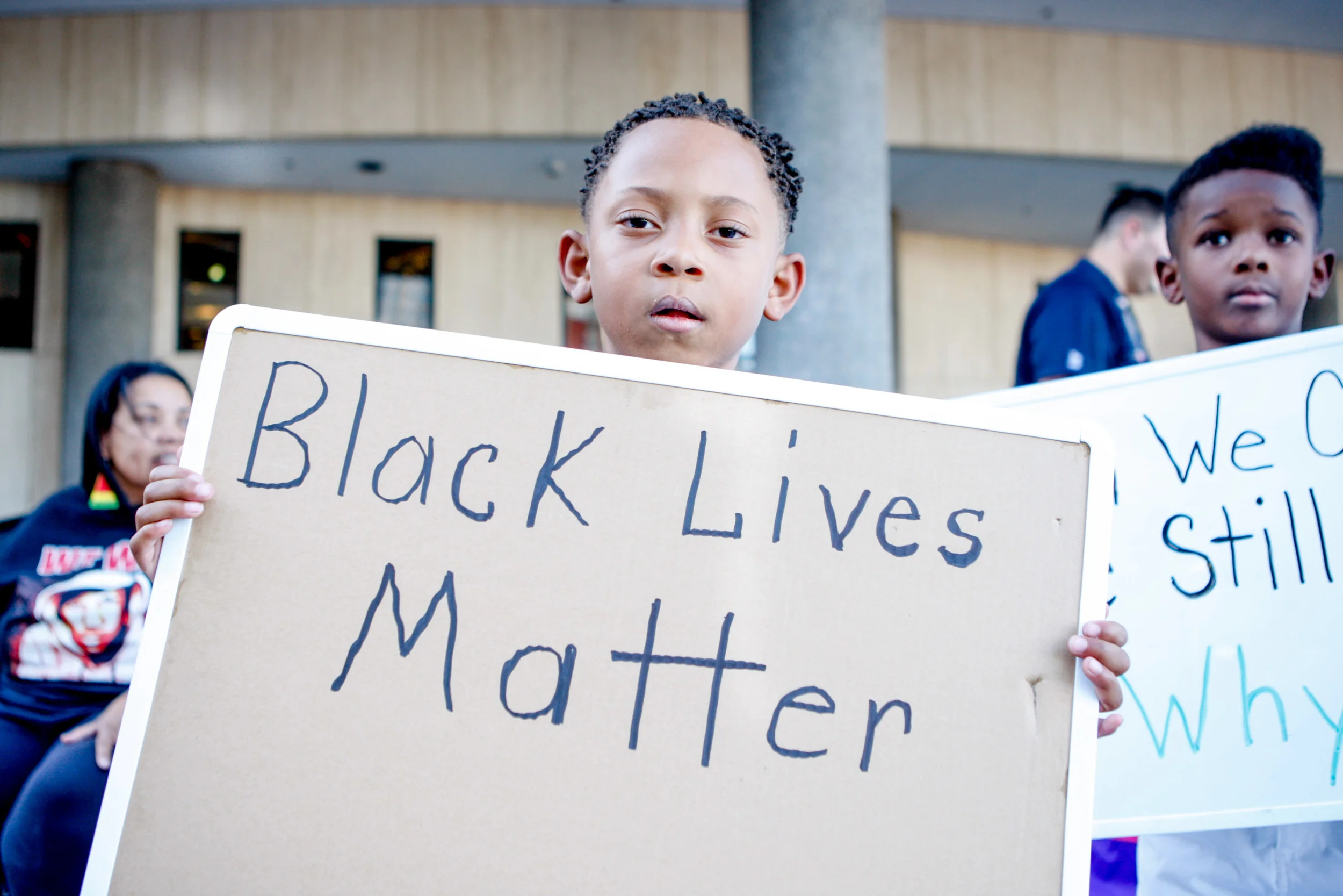 Brody Watkins, 6, holds a sign while protesters gather at 400 Stewart Avenue in downtown Las Vegas during a Black Lives Matter demonstration on Saturday evening, July 16, 2016. Elizabeth Brumley/Las Vegas Review-Journal