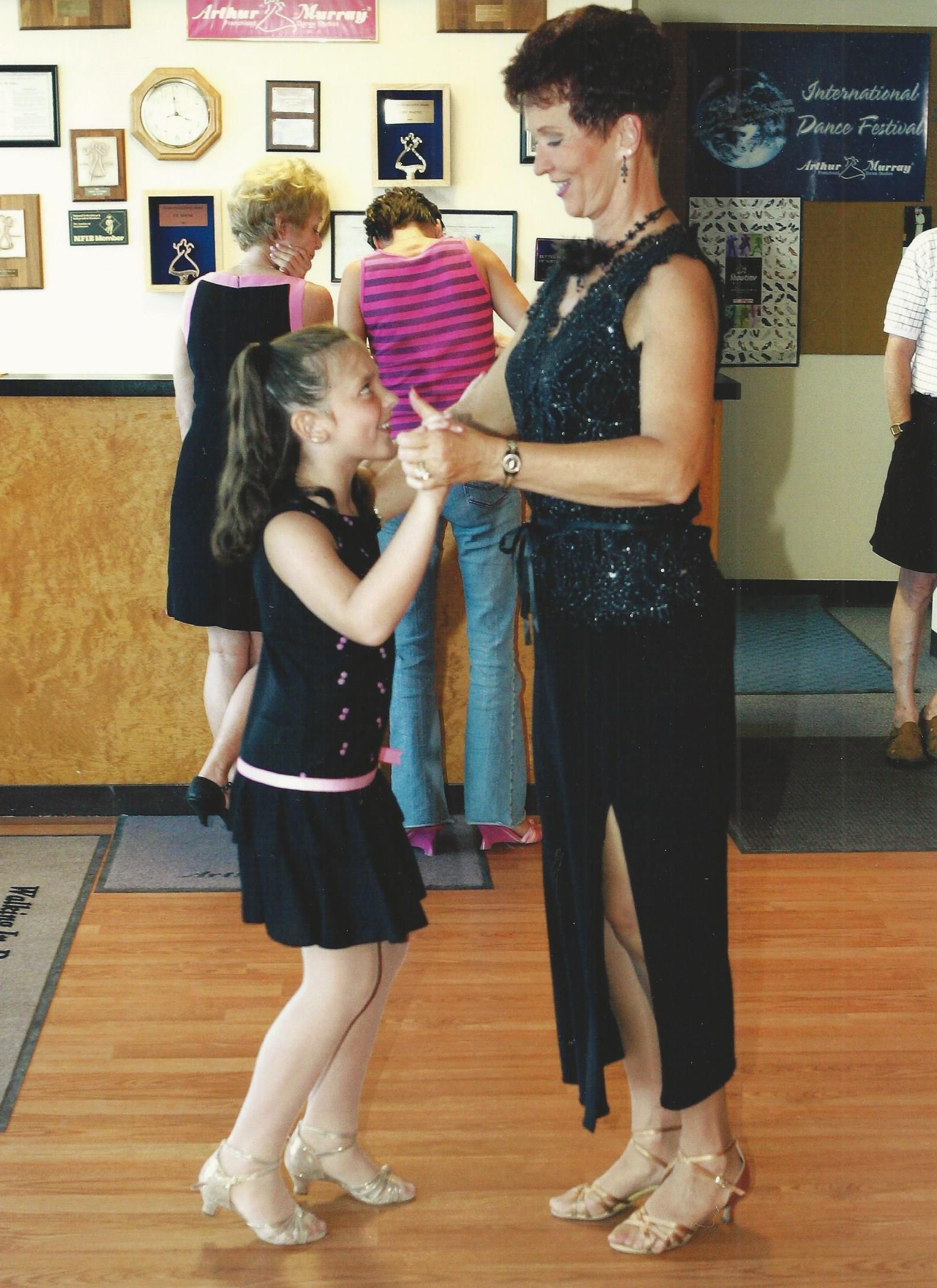 Gladys Dormire leading her granddaughter, Jordan.