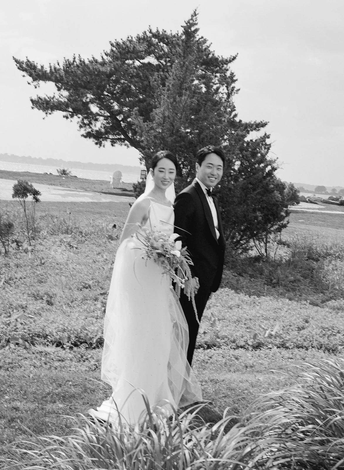 Couple poses for wedding photo in Newport, Rhode Island.