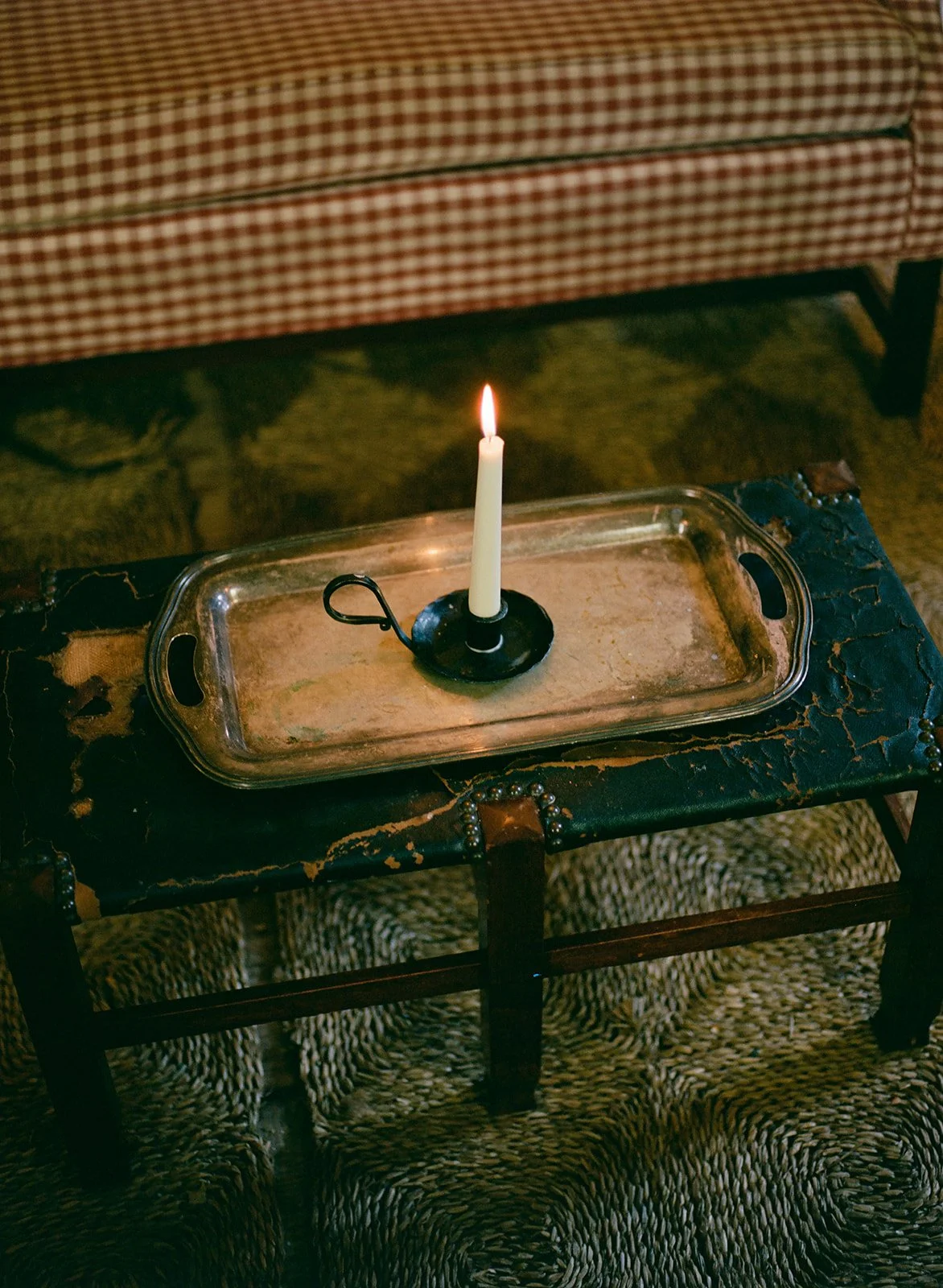 A candle glows in the woodshed of Stissing House in Hudson, New York.