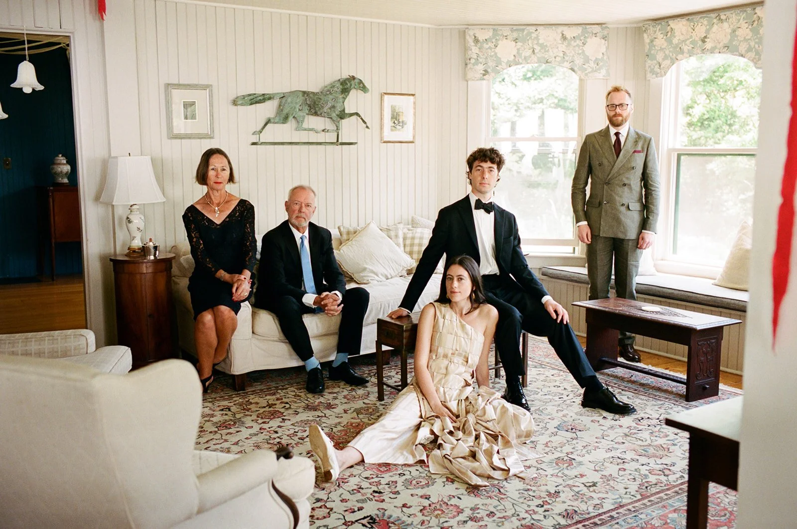 Family poses for a stylized family portrait inside estate on Cape Cod, Massachusetts.