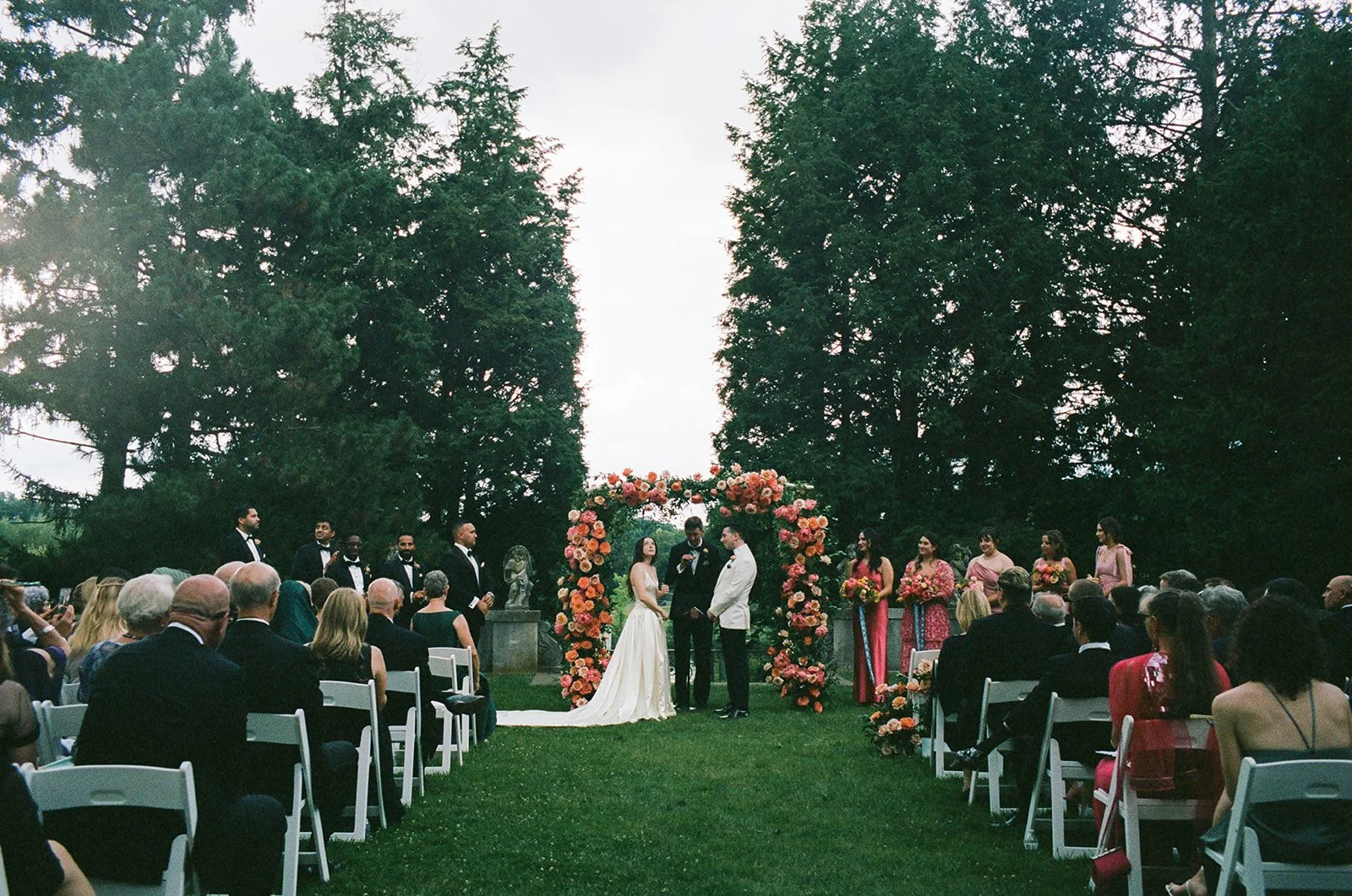 New York City couple enjoys wedding ceremony at Cranbrook House and Gardens in Michigan.